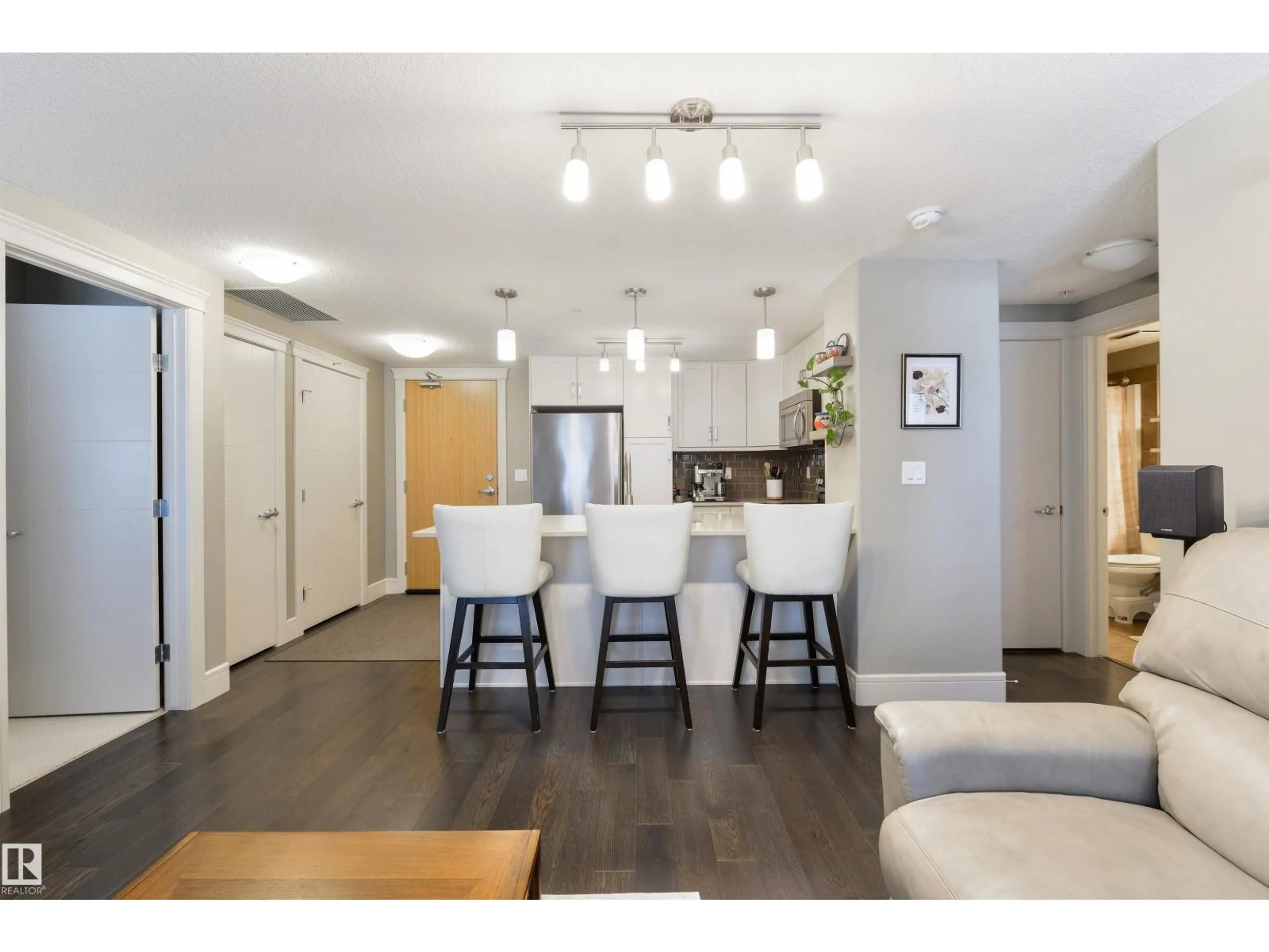 Open concept kitchen, wood/laminate floor for #219 - 7508 GETTY GATE, Edmonton Alberta T5T7E6