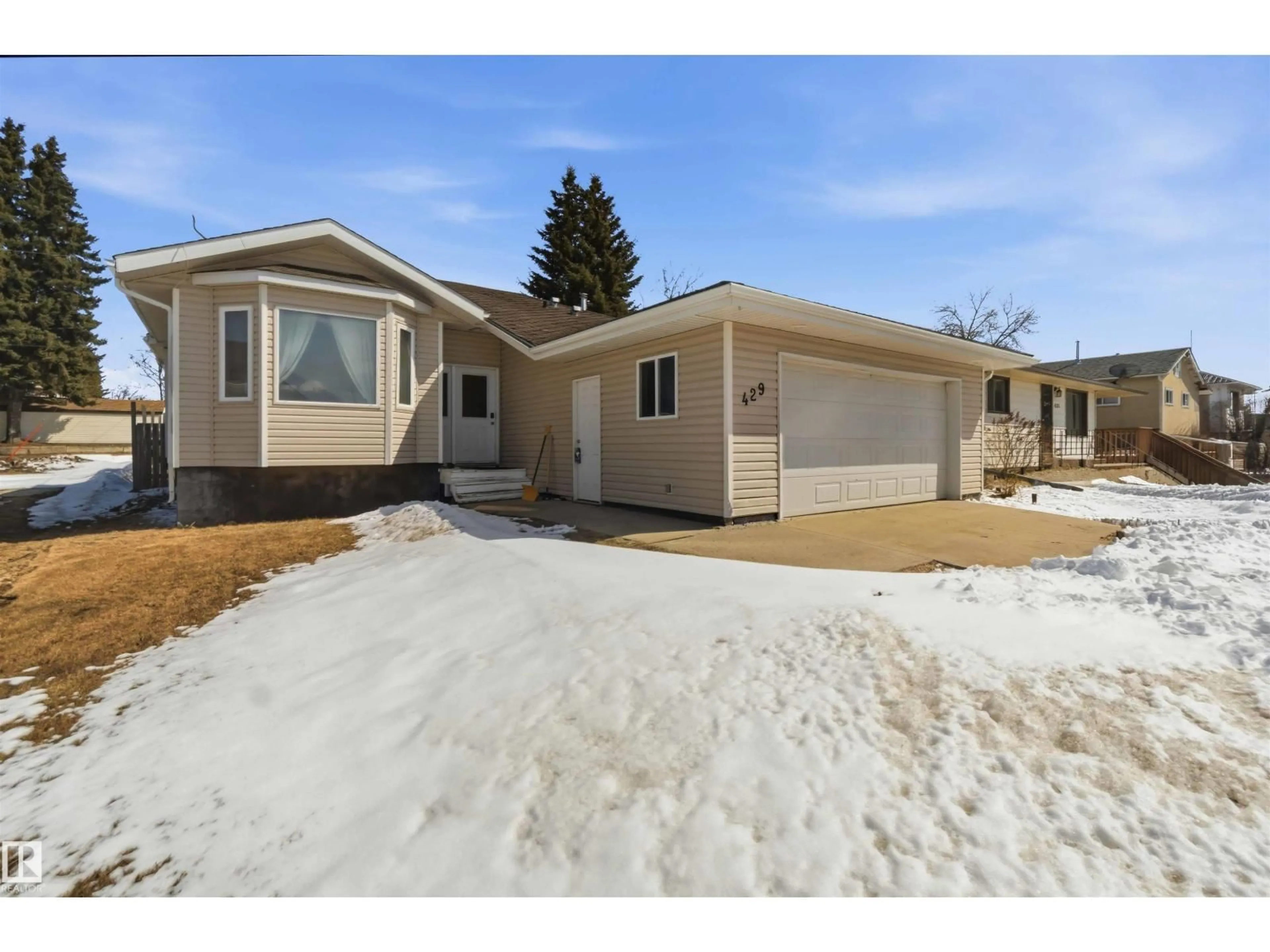 Home with vinyl exterior material, street for 429 5 ST, Thorhild Alberta T0A2J0