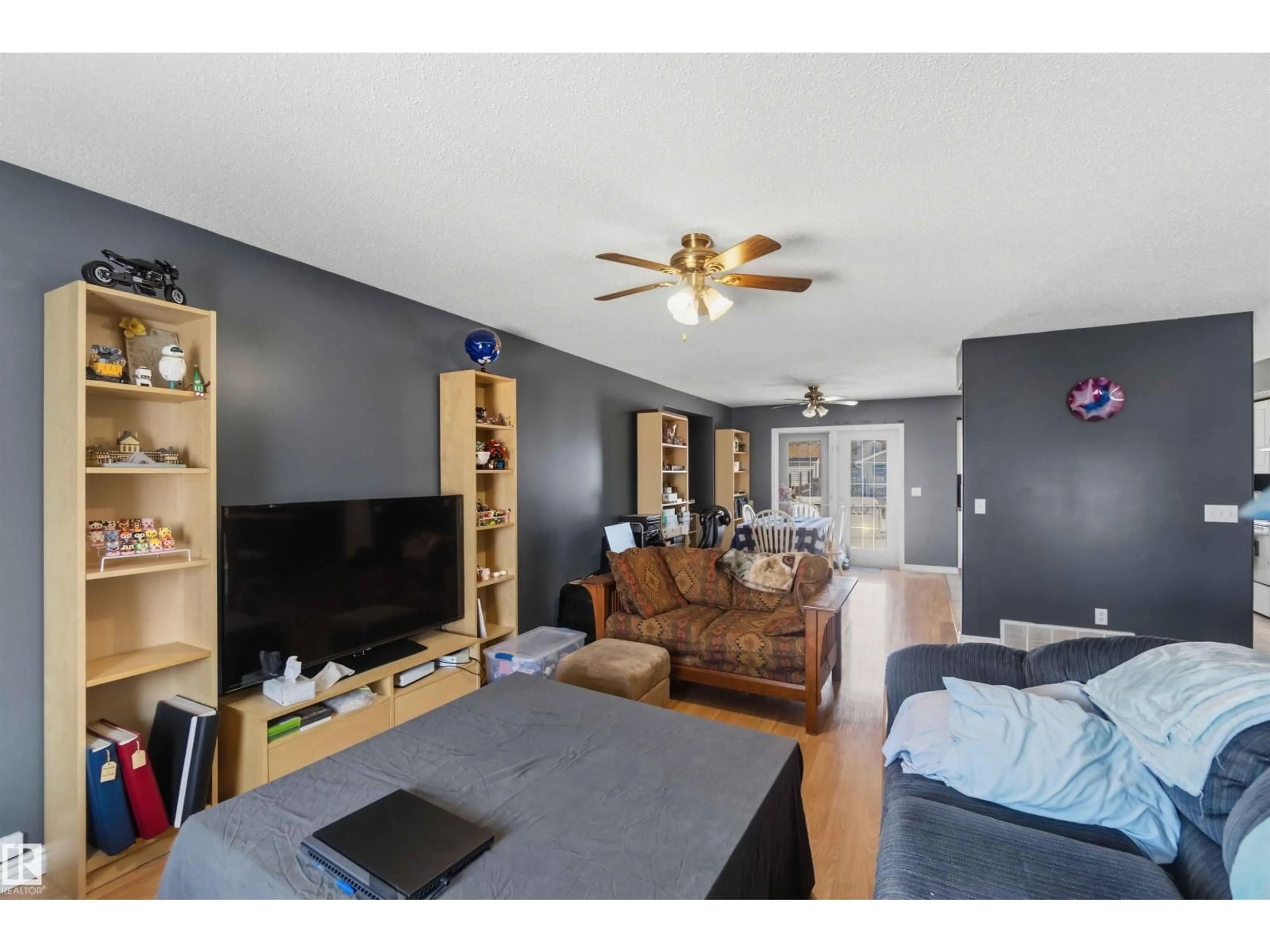 Living room with furniture, wood/laminate floor for 429 5 ST, Thorhild Alberta T0A2J0