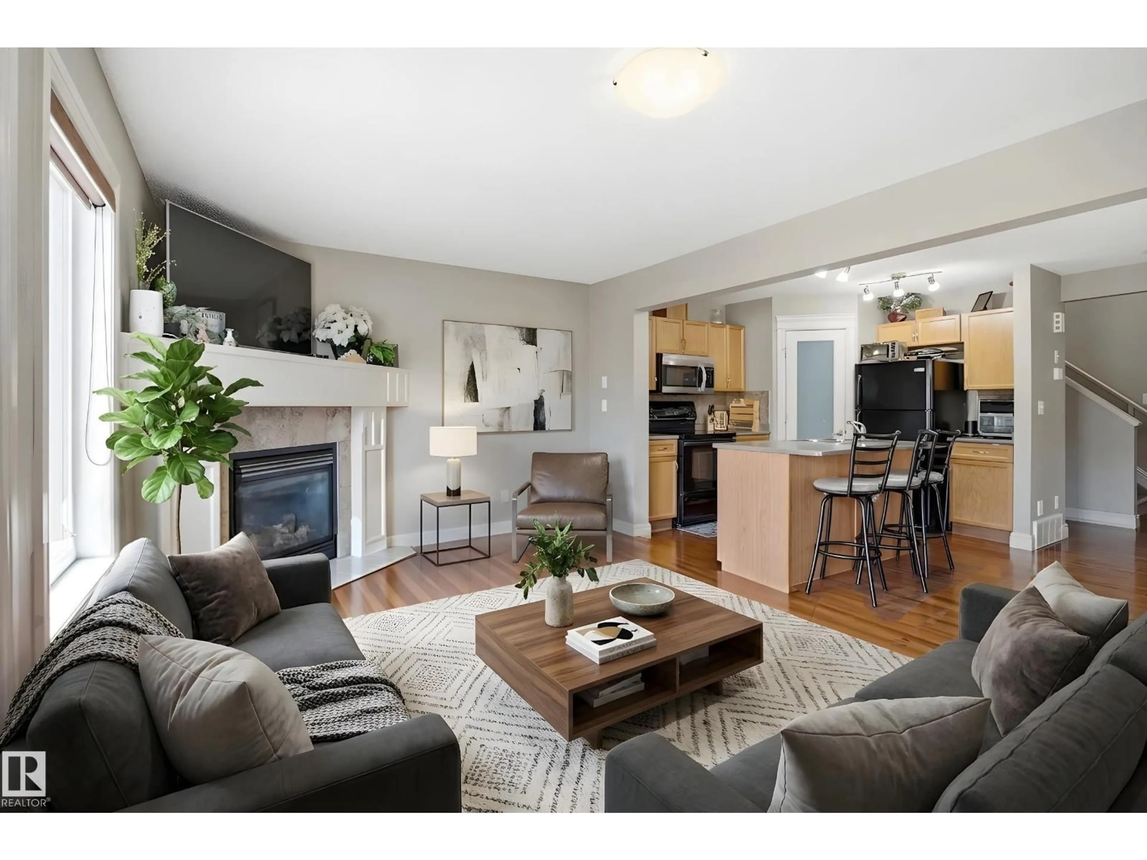 Living room with furniture, wood/laminate floor for 3533 11 STREET, Edmonton Alberta T6T0J7