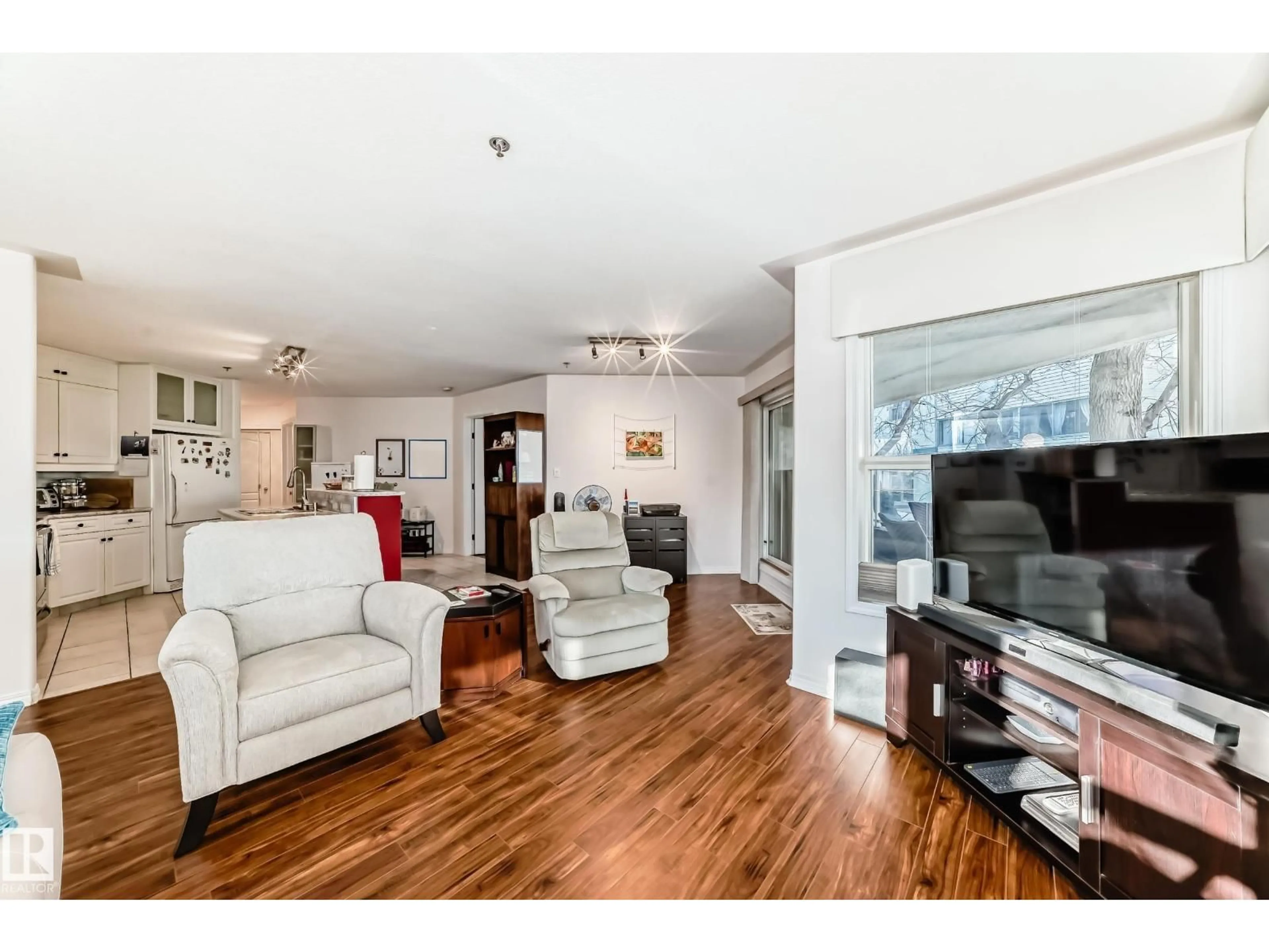 Living room with furniture, wood/laminate floor for #108 - 12028 103 AV, Edmonton Alberta T5K2T9