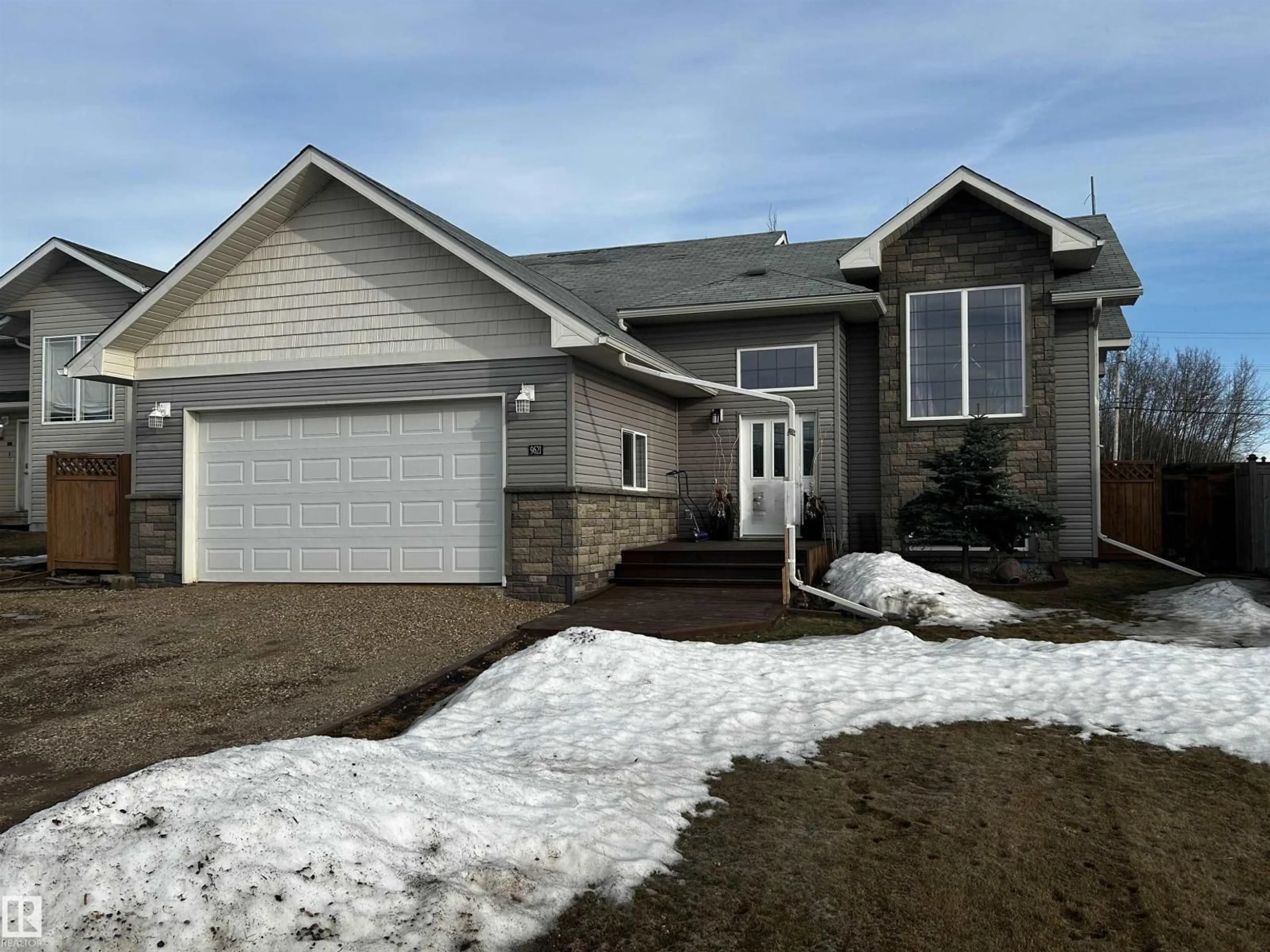 Home with vinyl exterior material, street for 9621 100 AVE, Lac La Biche Alberta T0A2C0