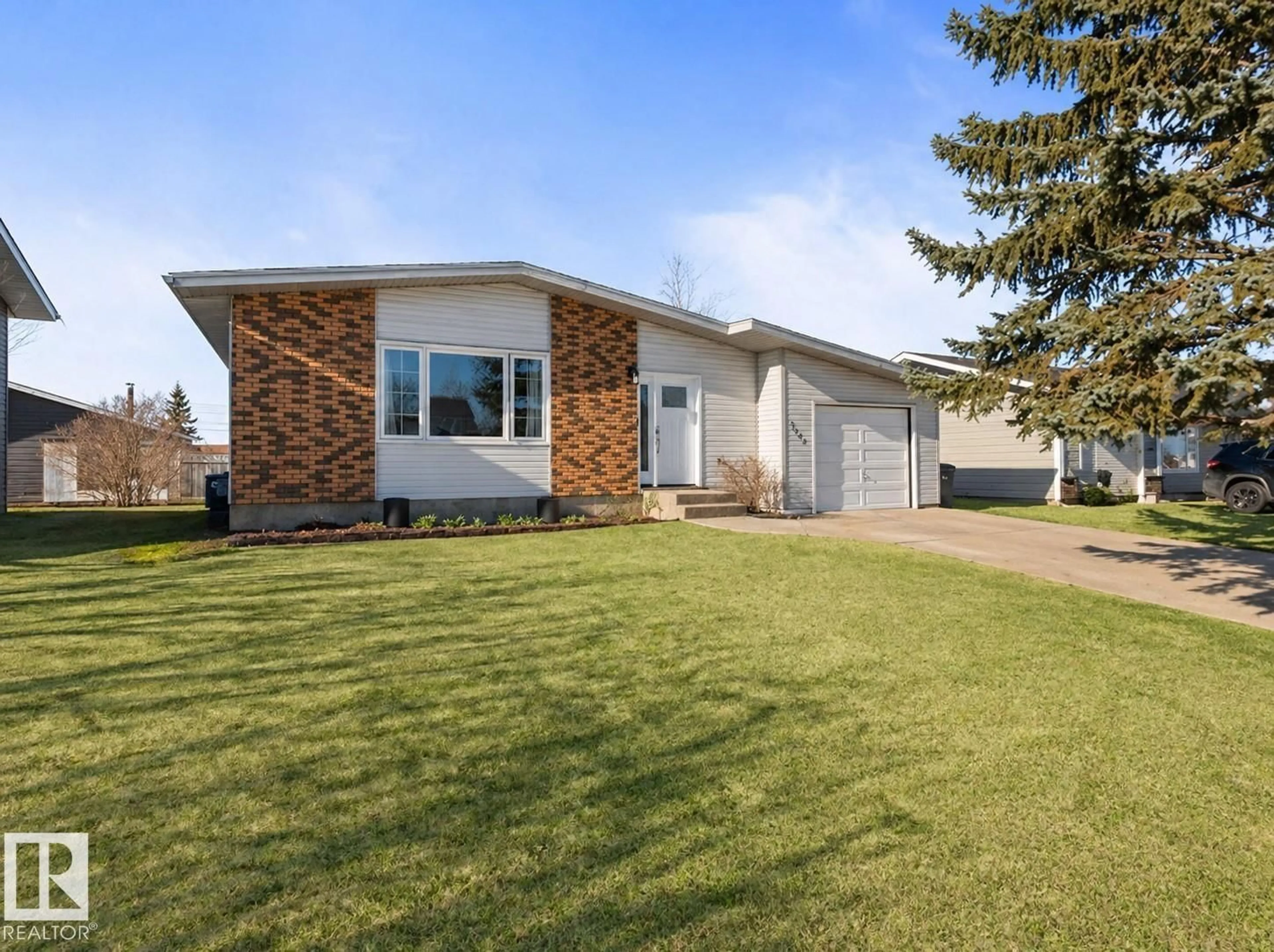 Home with vinyl exterior material, street for 1404 7 AV, Cold Lake Alberta T9M1B4