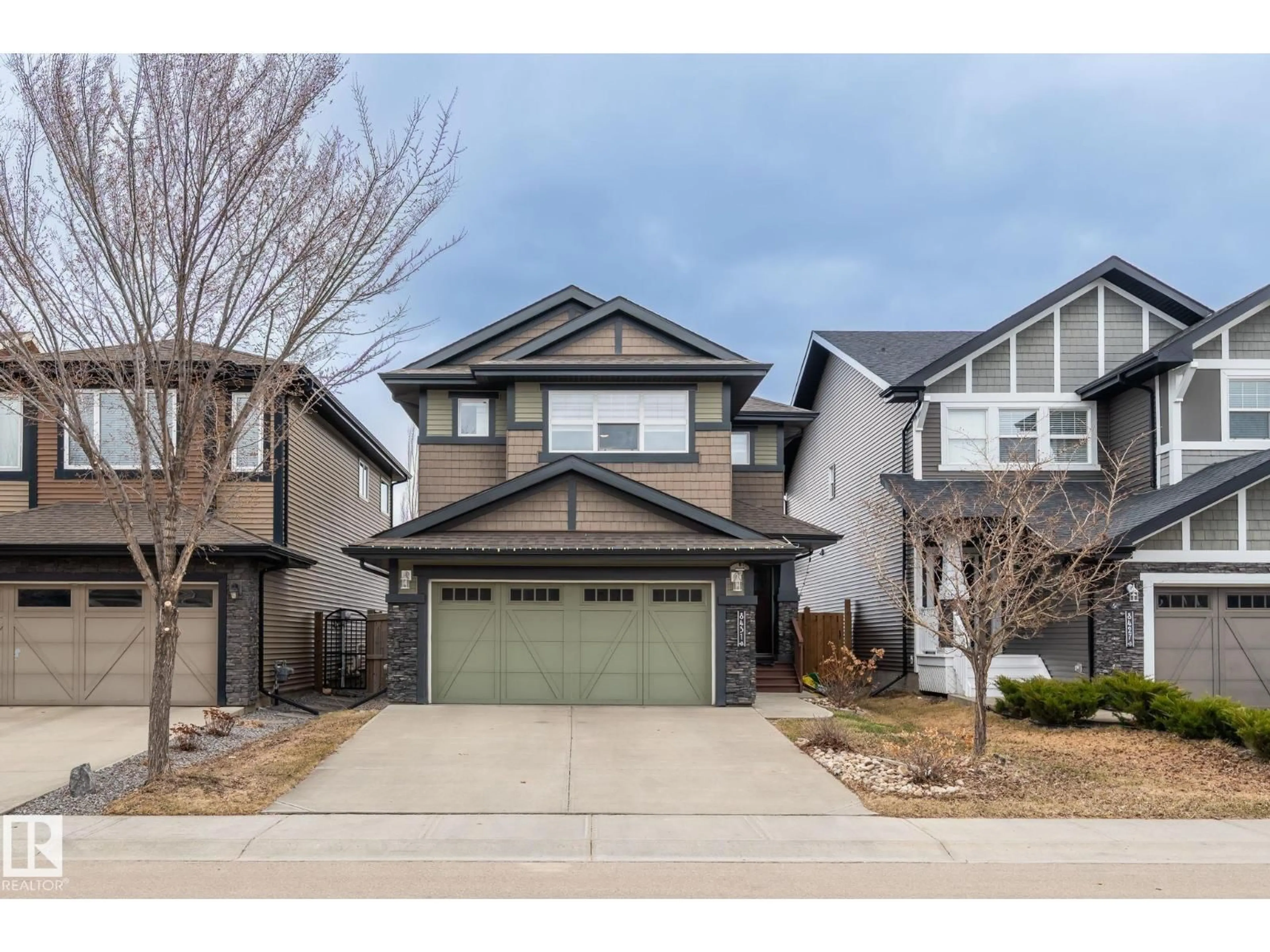 Home with vinyl exterior material, street for 8431 216 ST, Edmonton Alberta T5T4W2