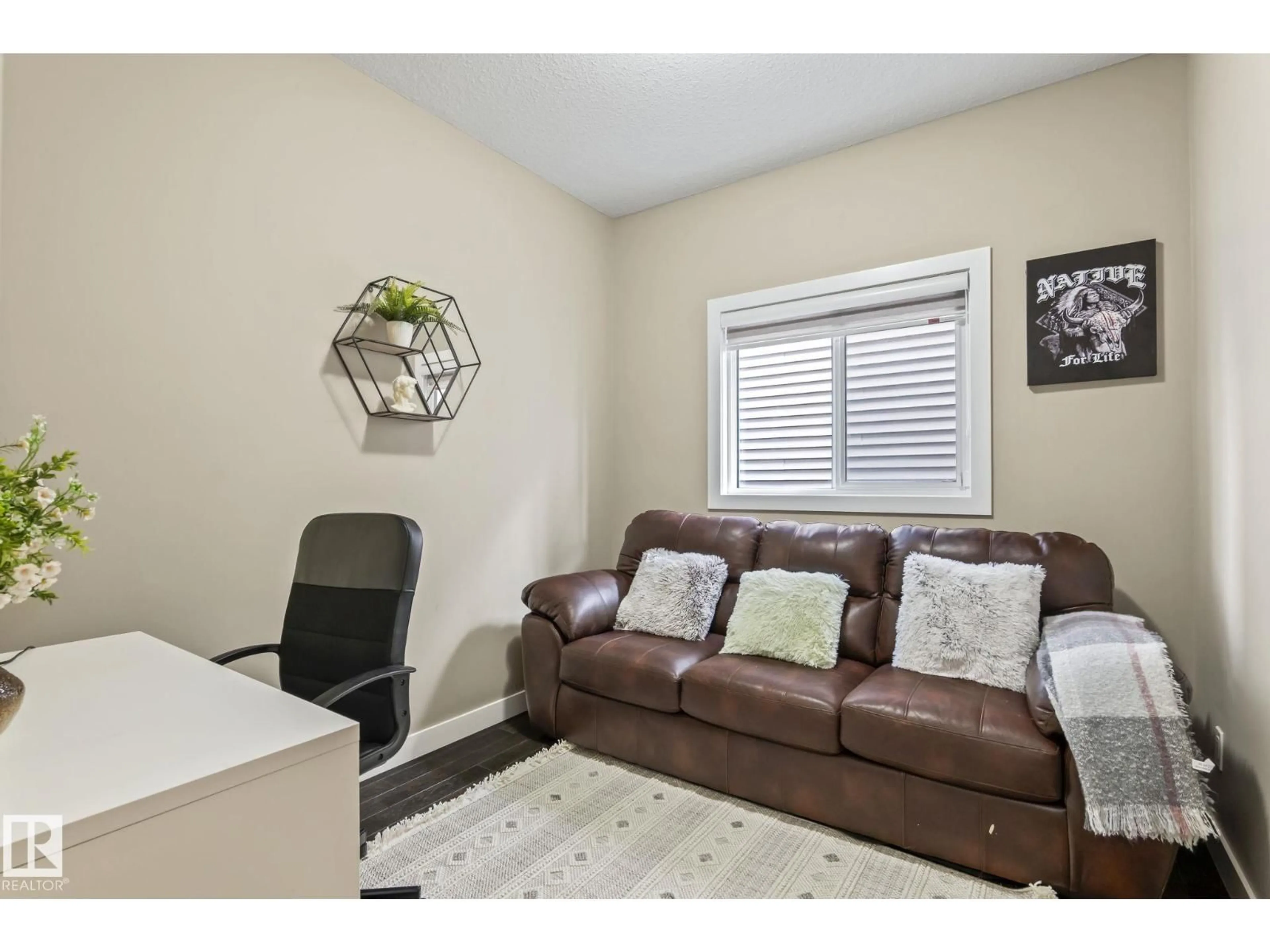 Living room with furniture, wood/laminate floor for 8431 216 ST, Edmonton Alberta T5T4W2