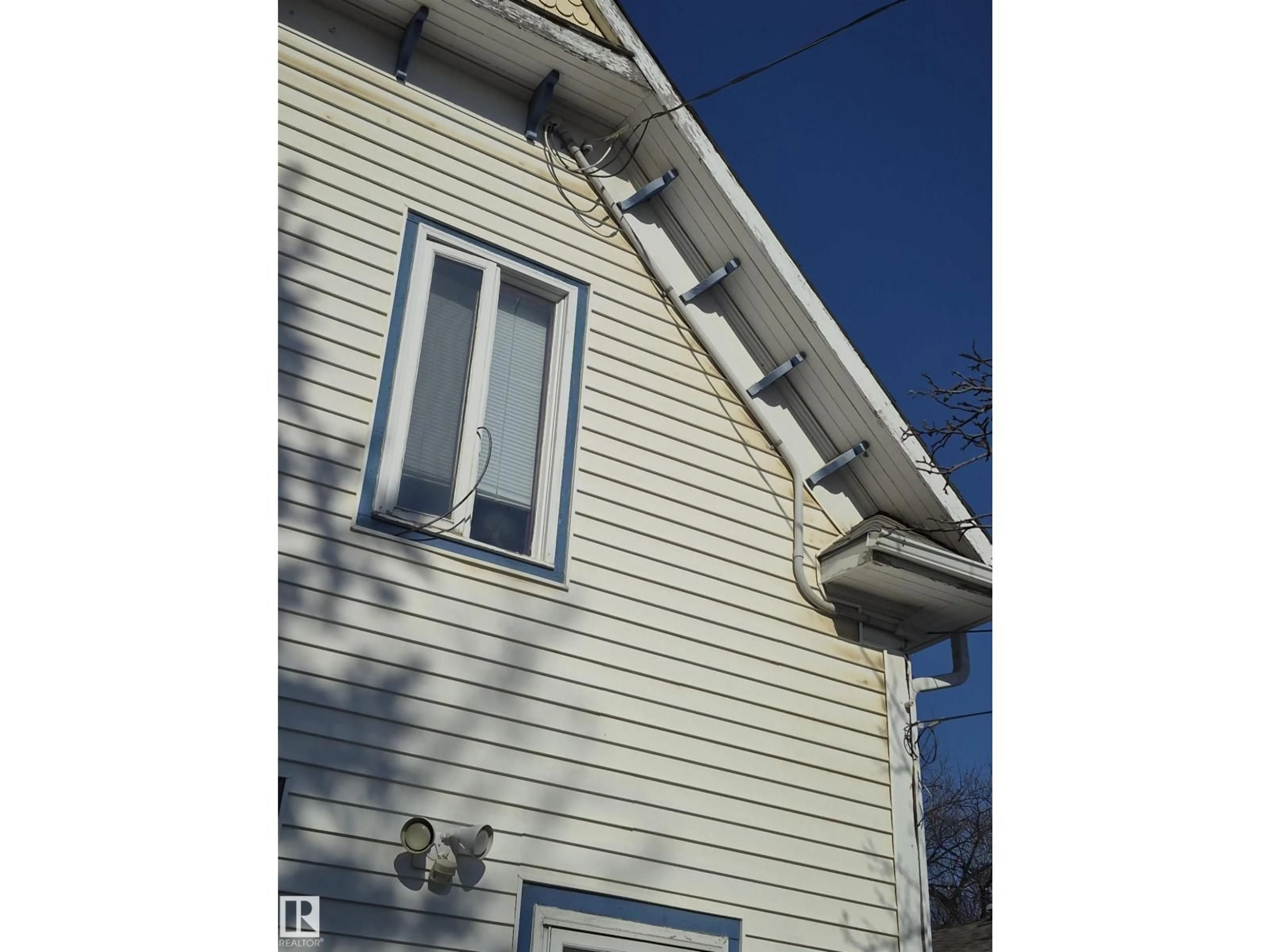Home with vinyl exterior material, building for NW - 11301 87 ST, Edmonton Alberta T5B3L8