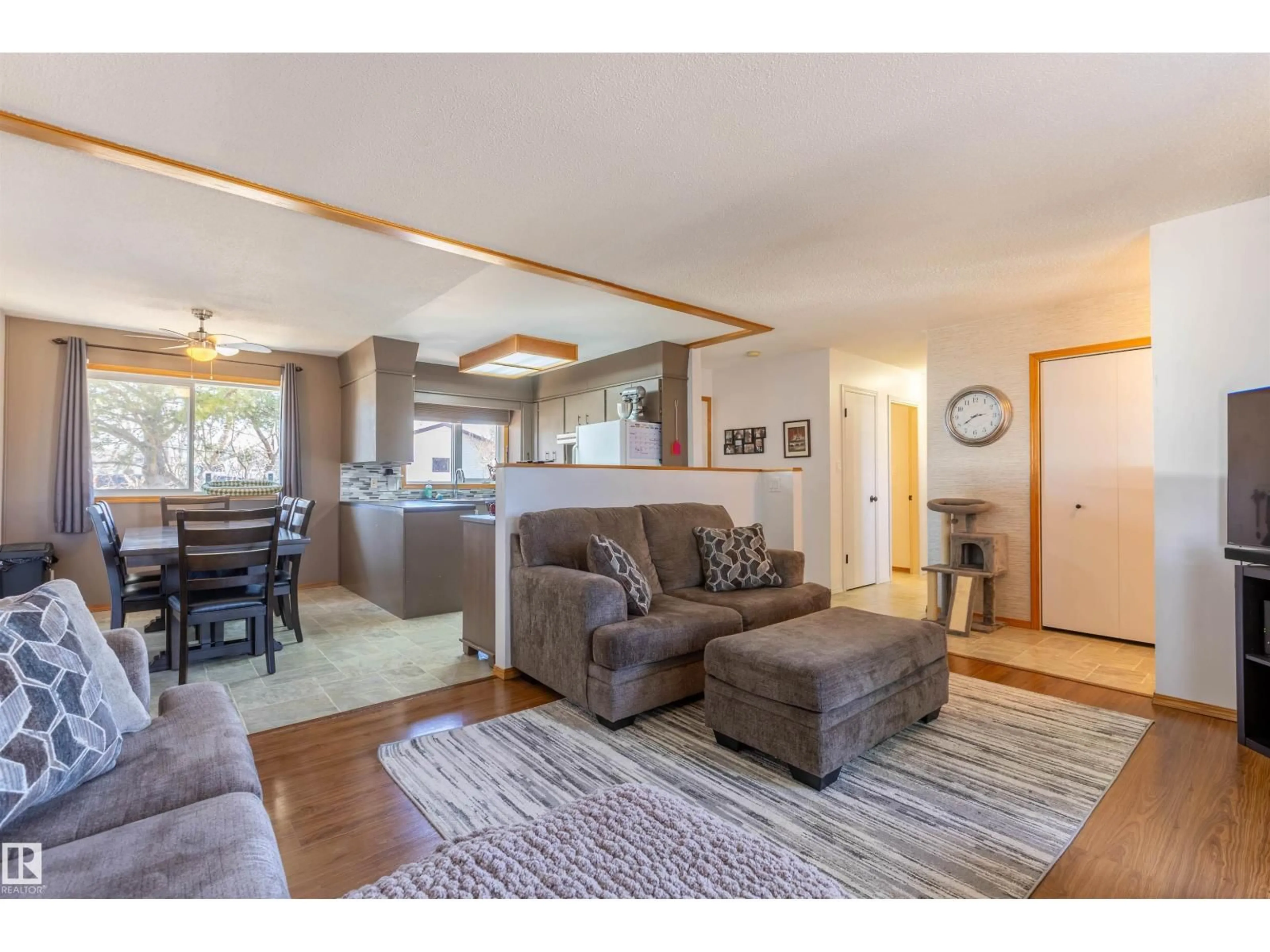 Living room with furniture, wood/laminate floor for 4824 51 ST, Legal Alberta T0G1L0