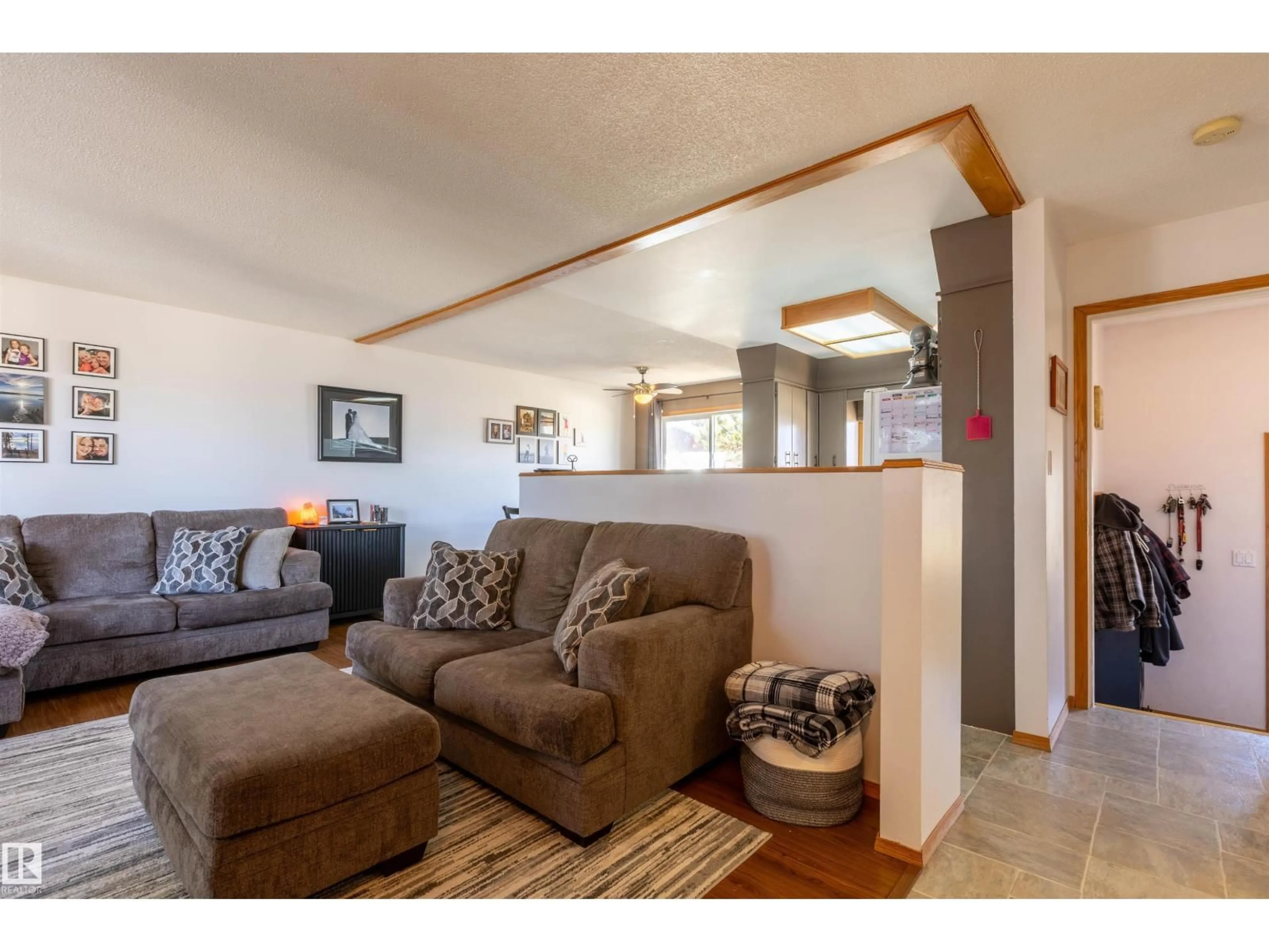 Living room with furniture, wood/laminate floor for 4824 51 ST, Legal Alberta T0G1L0