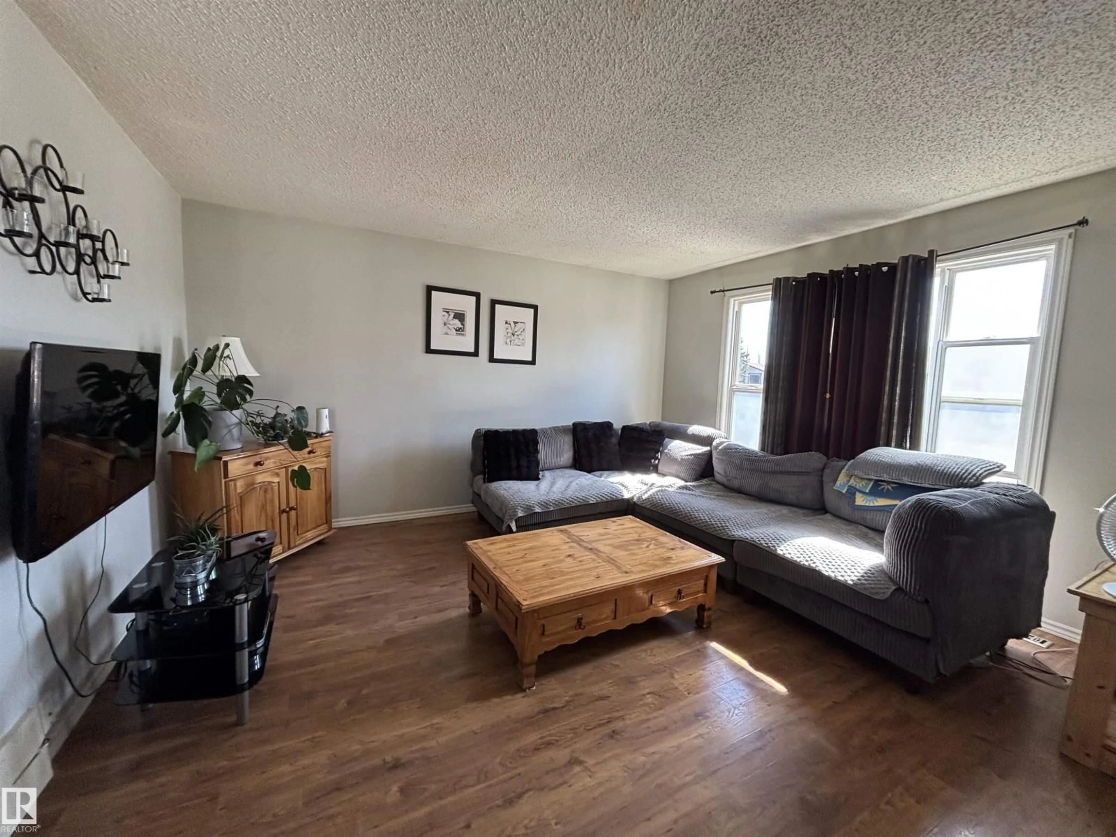 Living room with furniture, wood/laminate floor for 104 BIRCH DR, Gibbons Alberta T0A1N0
