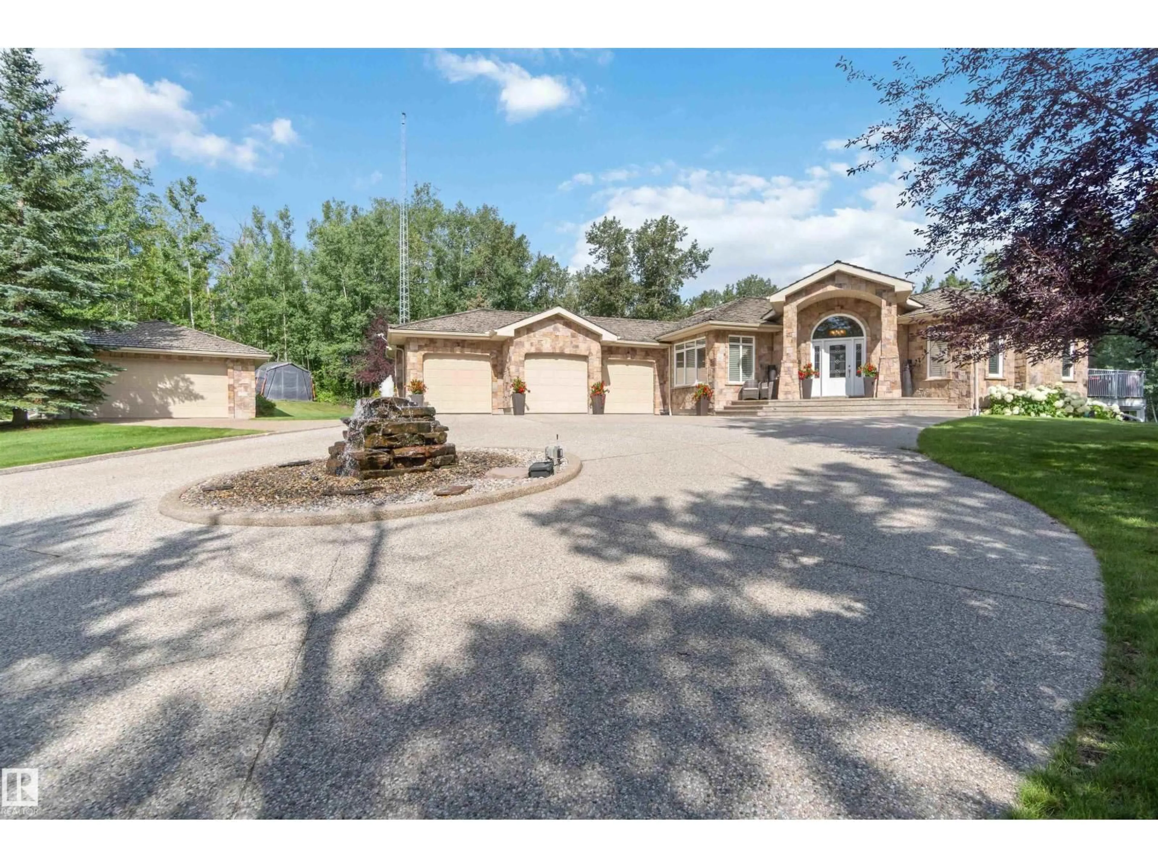 A pic from outside/outdoor area/front of a property/back of a property/a pic from drone, street for 6 - 54030 RGE ROAD 275, Rural Parkland County Alberta T7X3V4