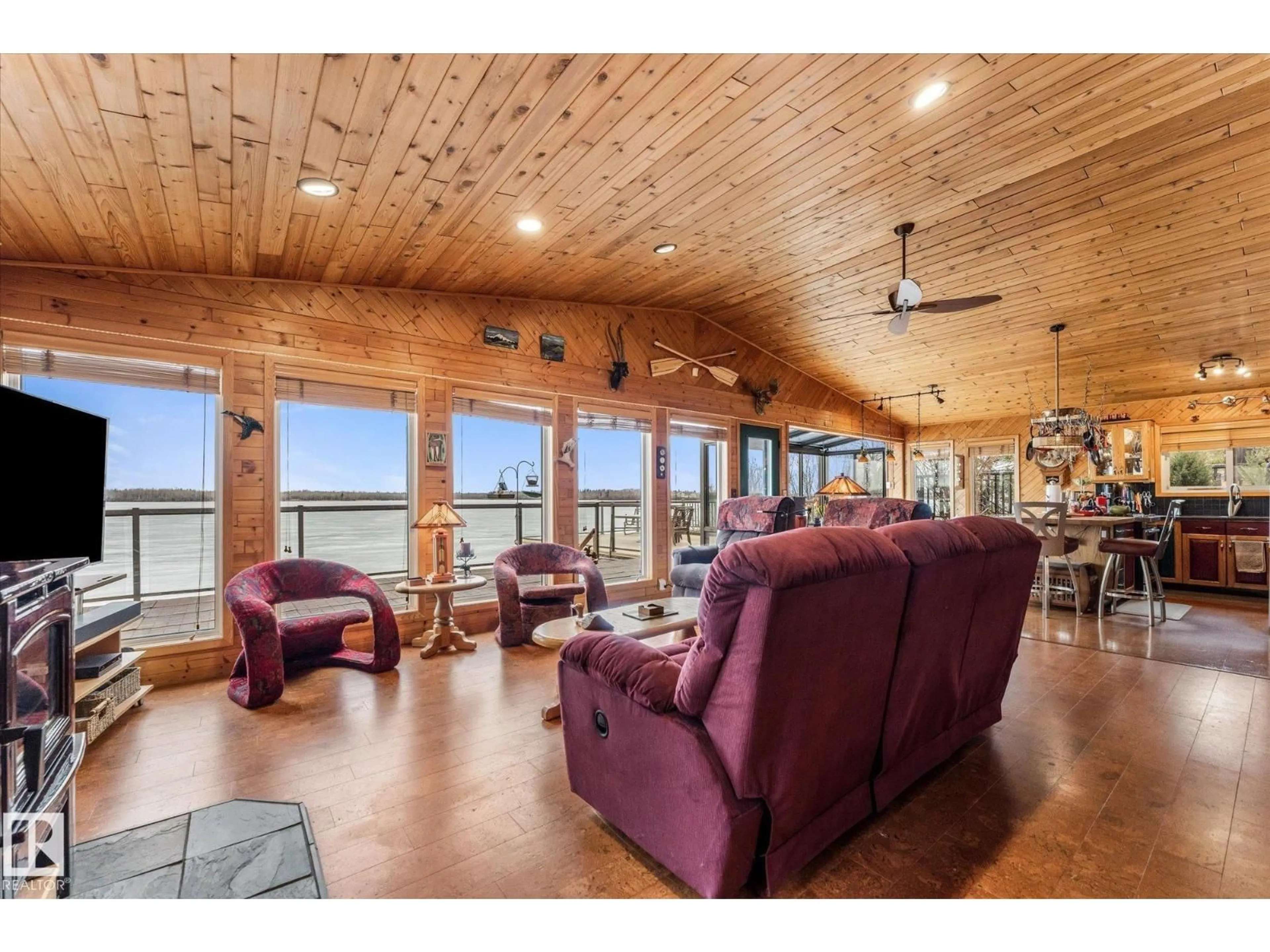 Living room with furniture, wood/laminate floor for 5039 6 ST, Rural Lac Ste. Anne County Alberta T5M2T8