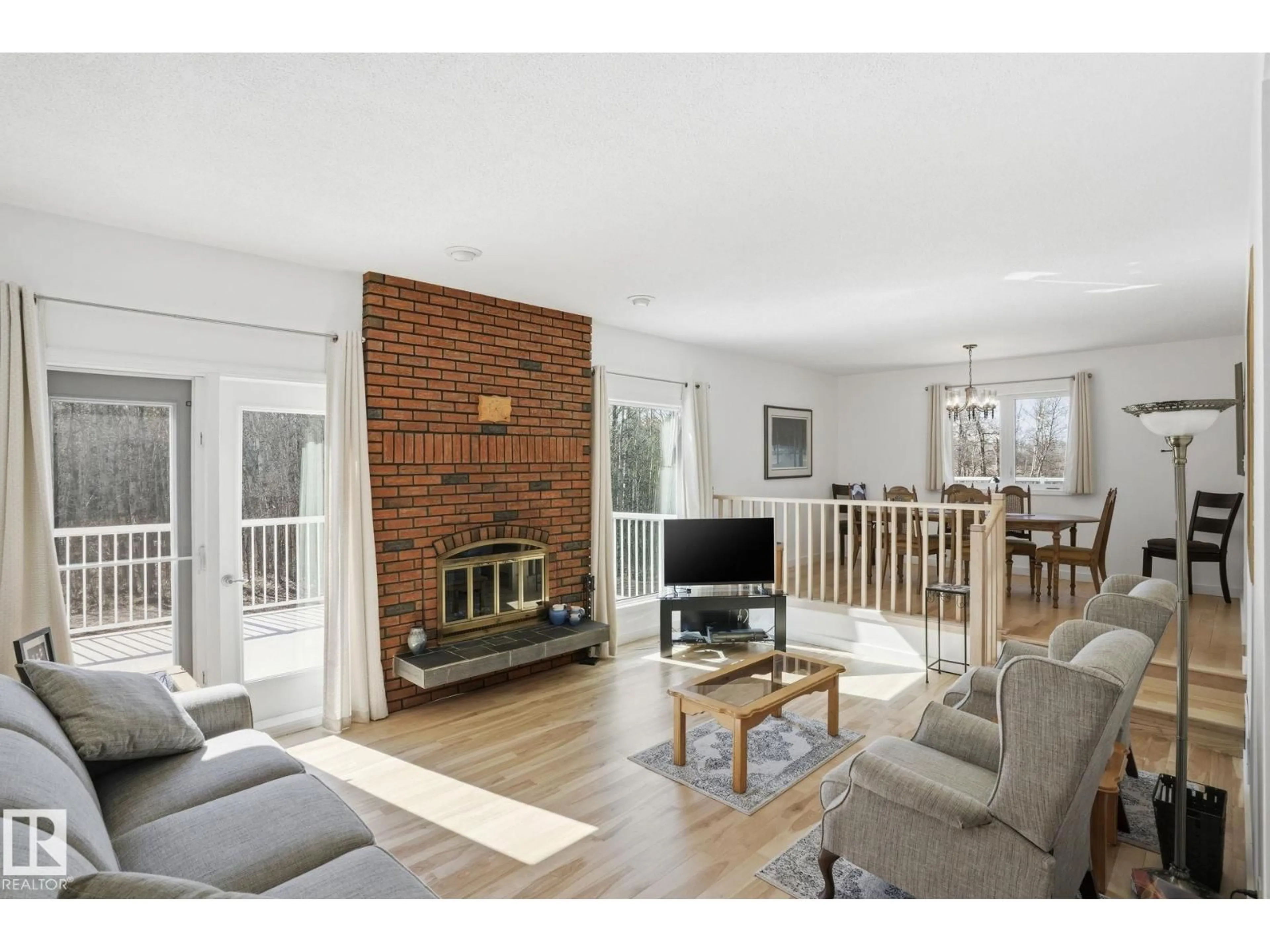 Living room with furniture, wood/laminate floor for 52516 - 9 RANGE ROAD 13, Rural Parkland County Alberta T7Y2C1