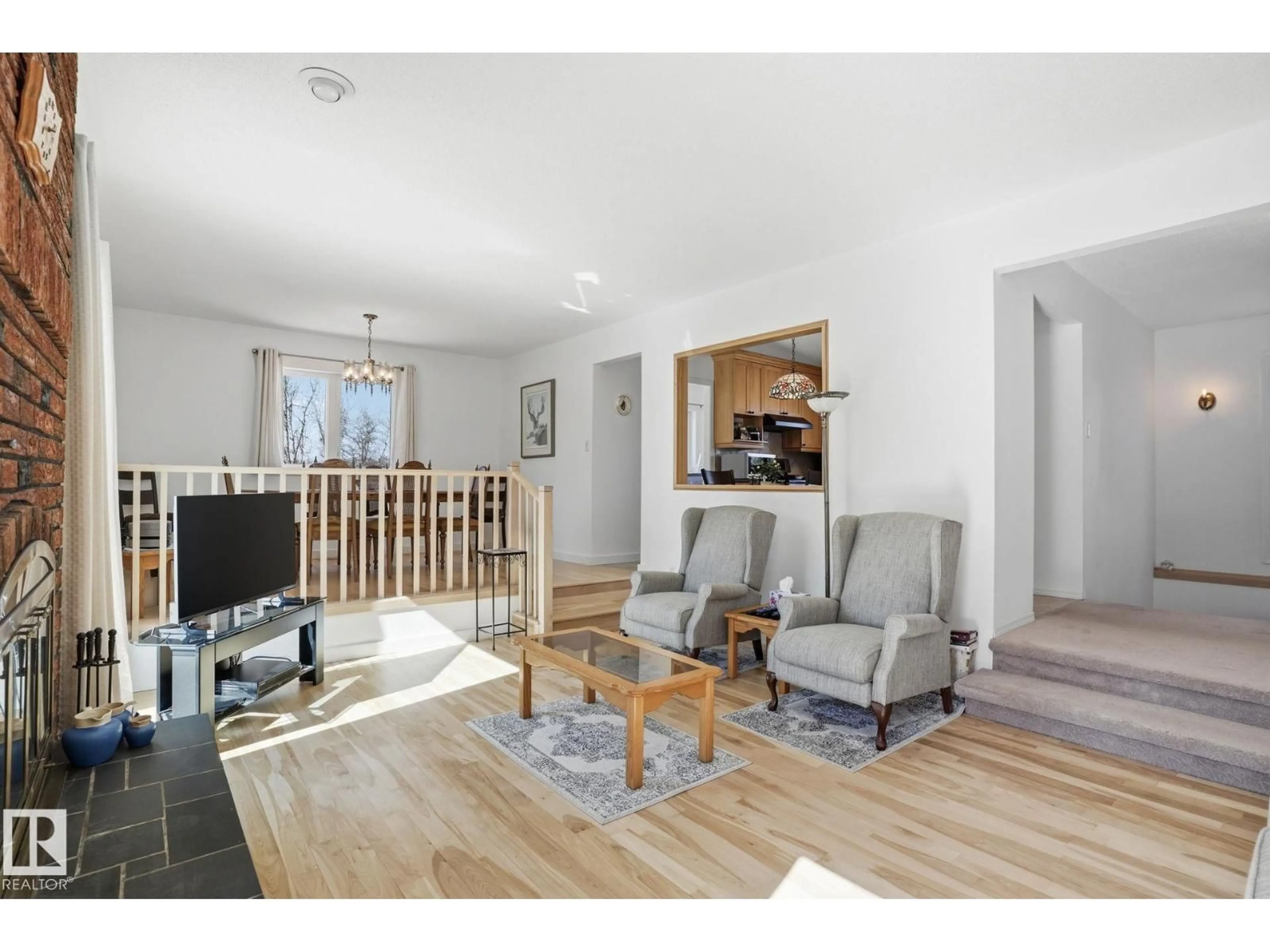 Living room with furniture, wood/laminate floor for 52516 - 9 RANGE ROAD 13, Rural Parkland County Alberta T7Y2C1