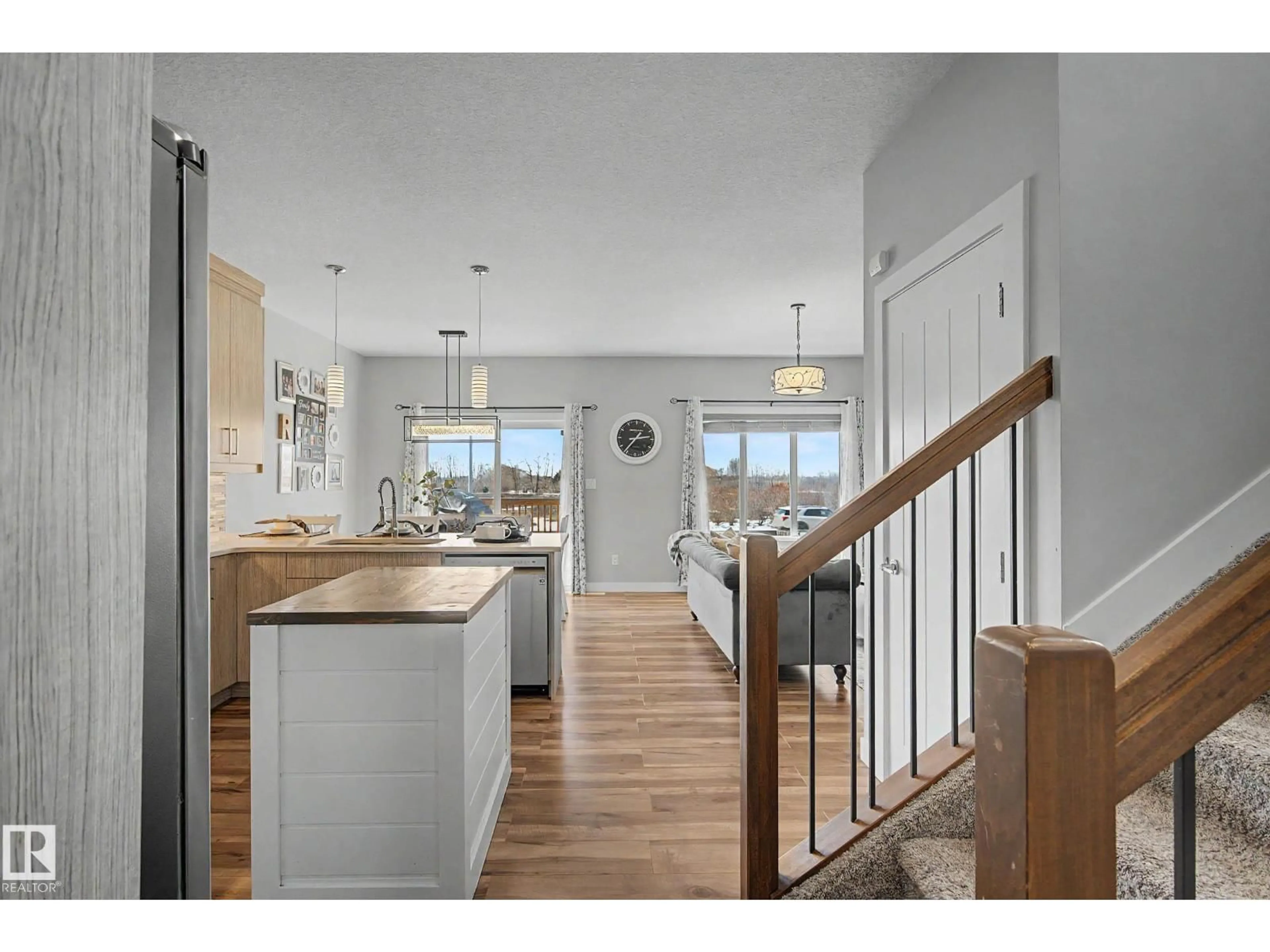 Open concept kitchen, wood/laminate floor for 5712 66 ST, Beaumont Alberta T4X2A4