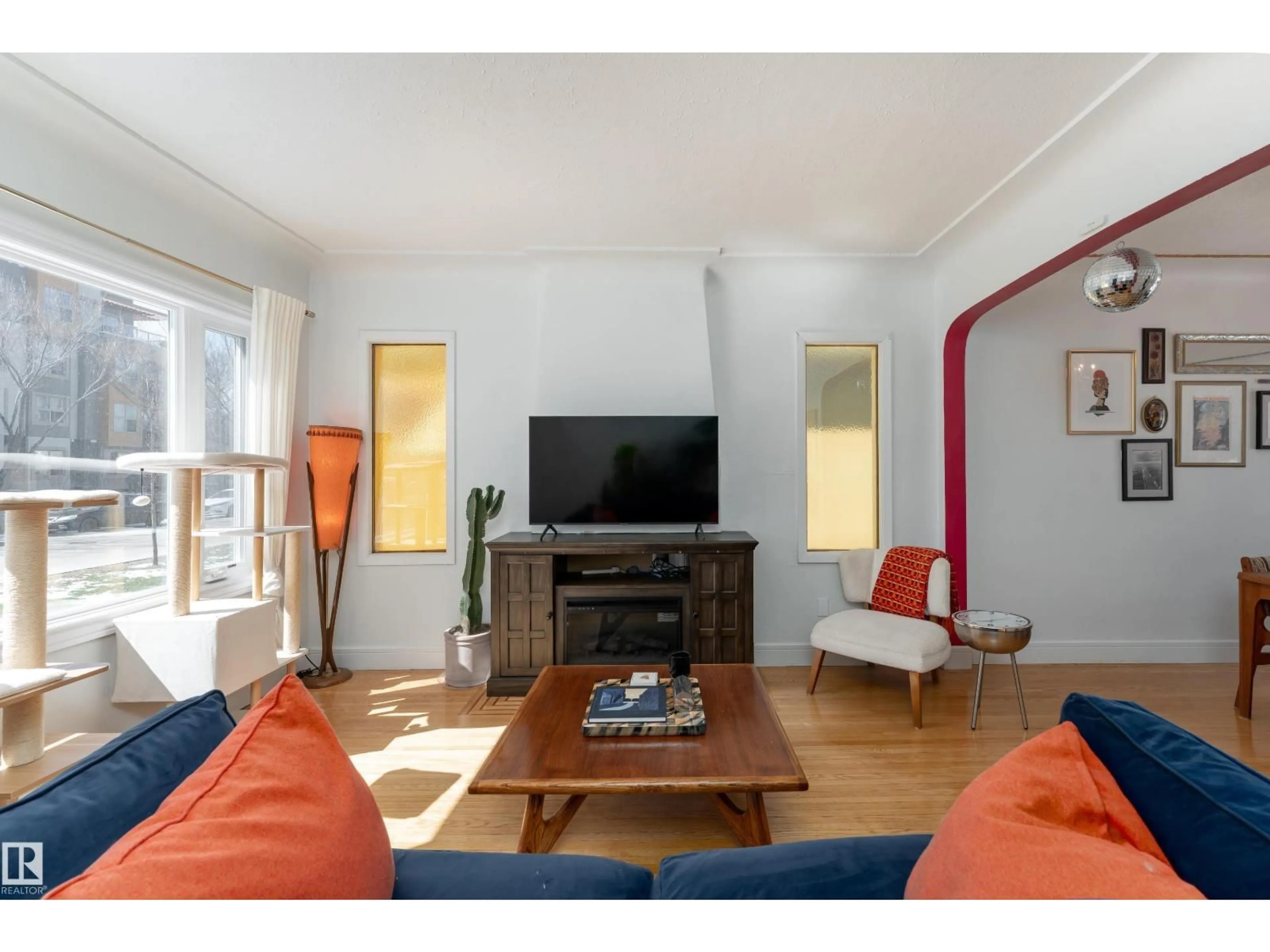Living room with furniture, wood/laminate floor for 9852 86 AV, Edmonton Alberta T6E2L6