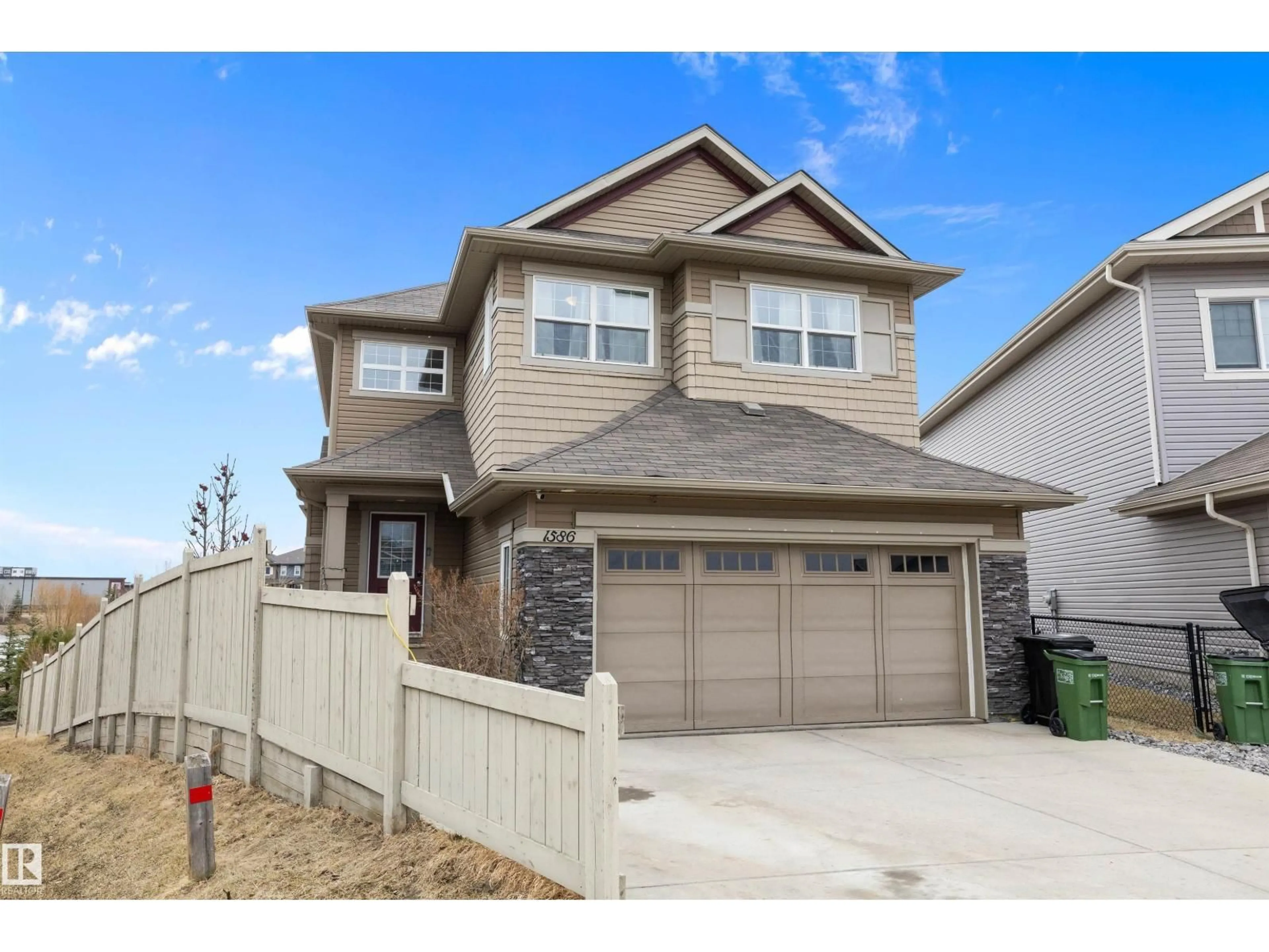 Home with vinyl exterior material, street for 1586 CHAPMAN WY, Edmonton Alberta T6W0Z2