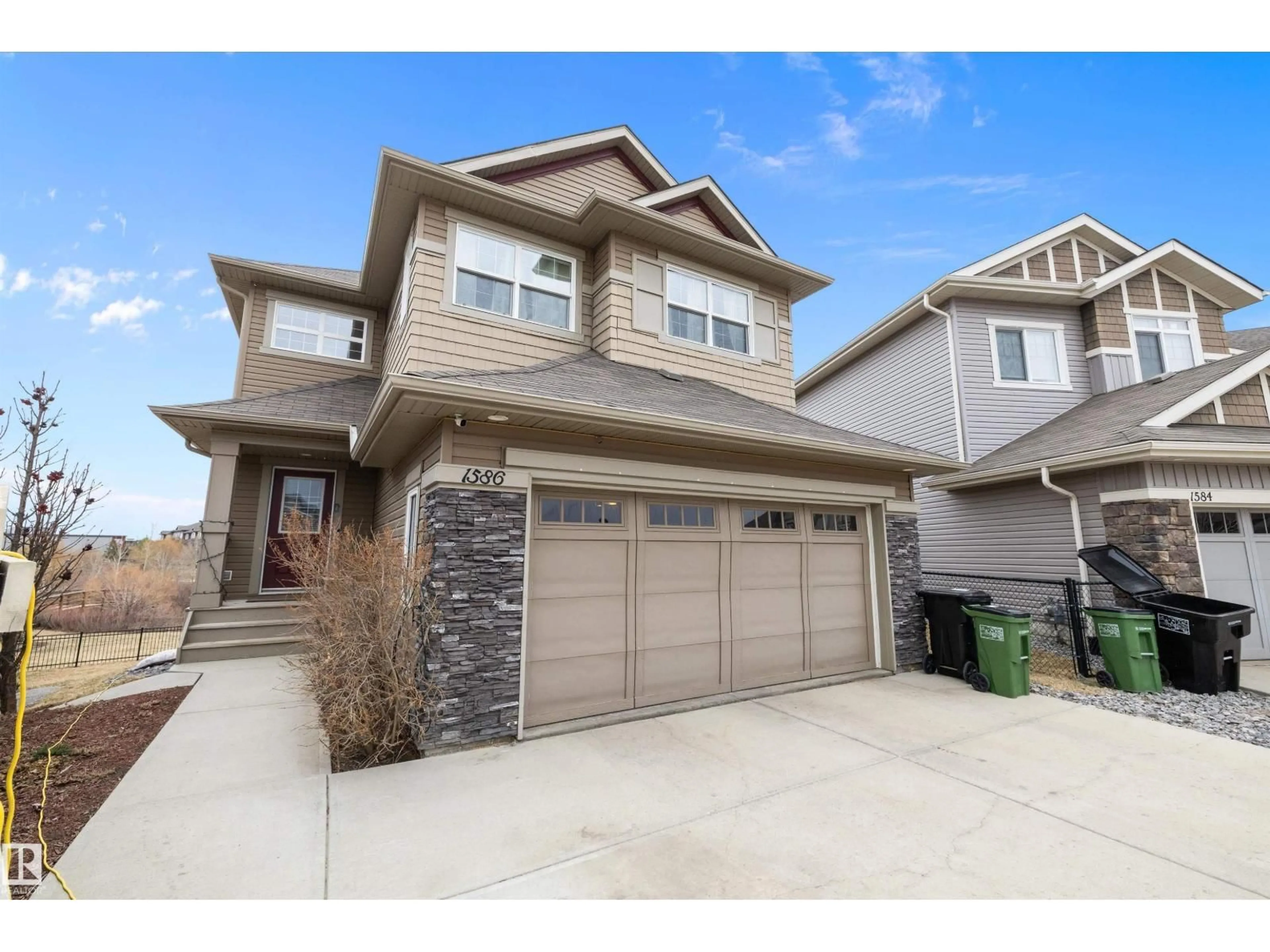 Home with vinyl exterior material, street for 1586 CHAPMAN WY, Edmonton Alberta T6W0Z2