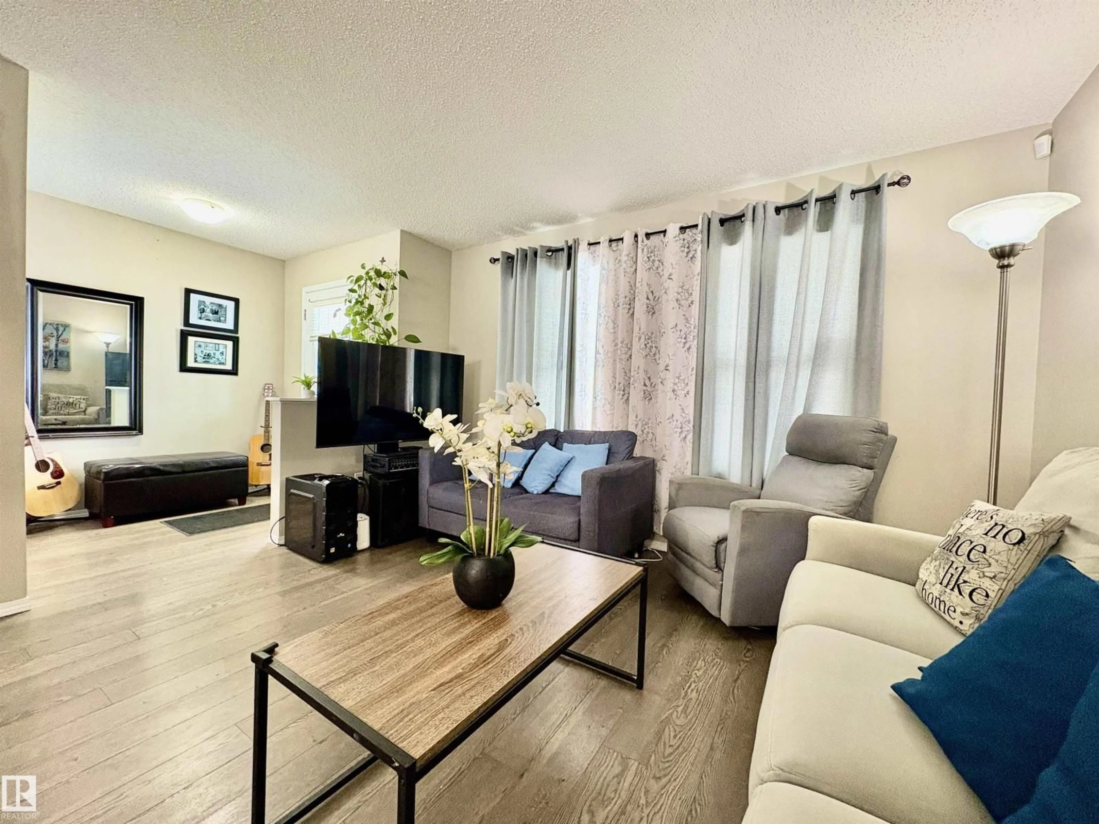 Living room with furniture, wood/laminate floor for SW - 2344 71 ST, Edmonton Alberta T6X1Z1