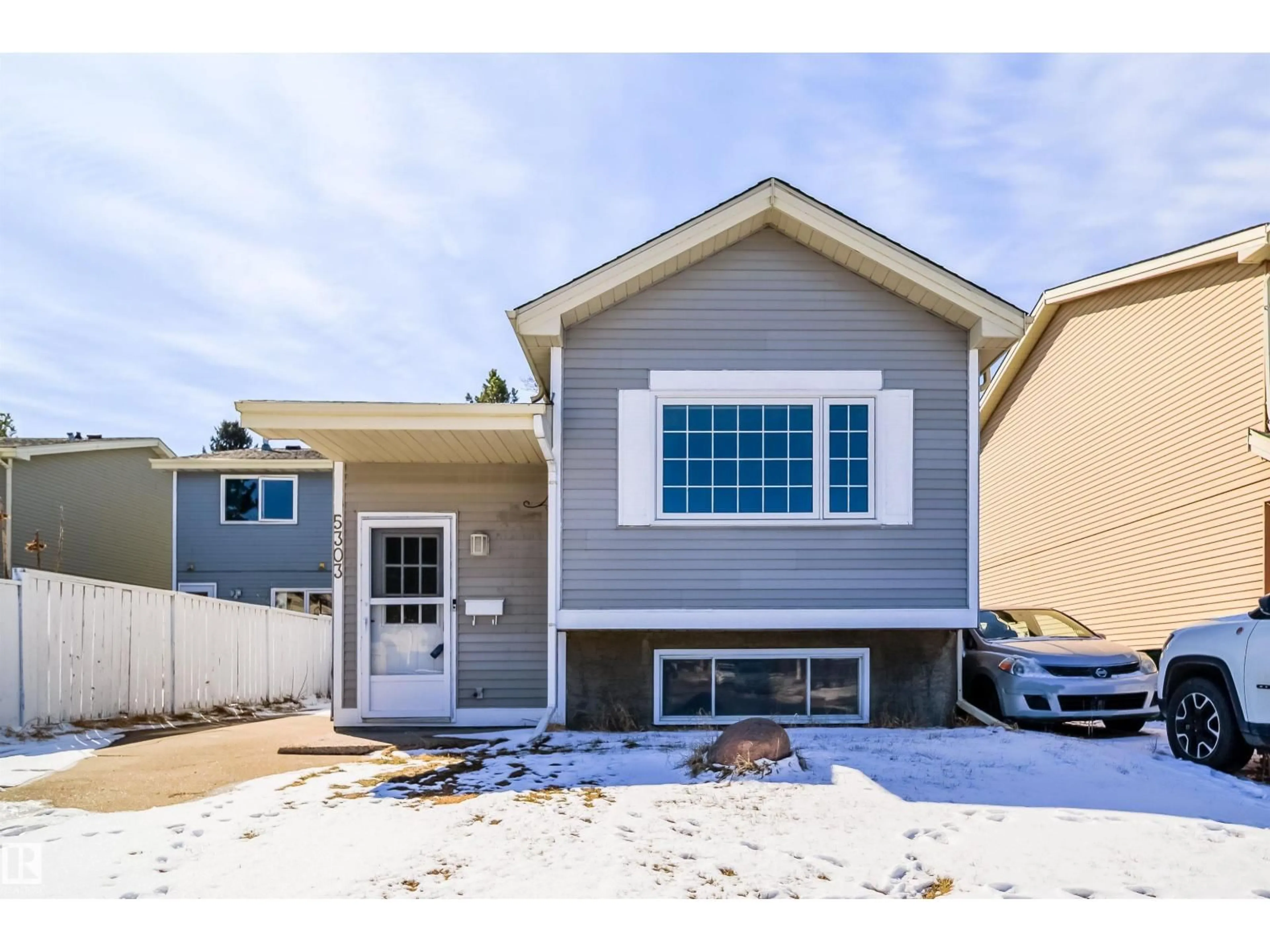 Home with vinyl exterior material, street for 5303 21 AV, Edmonton Alberta T6L5G5