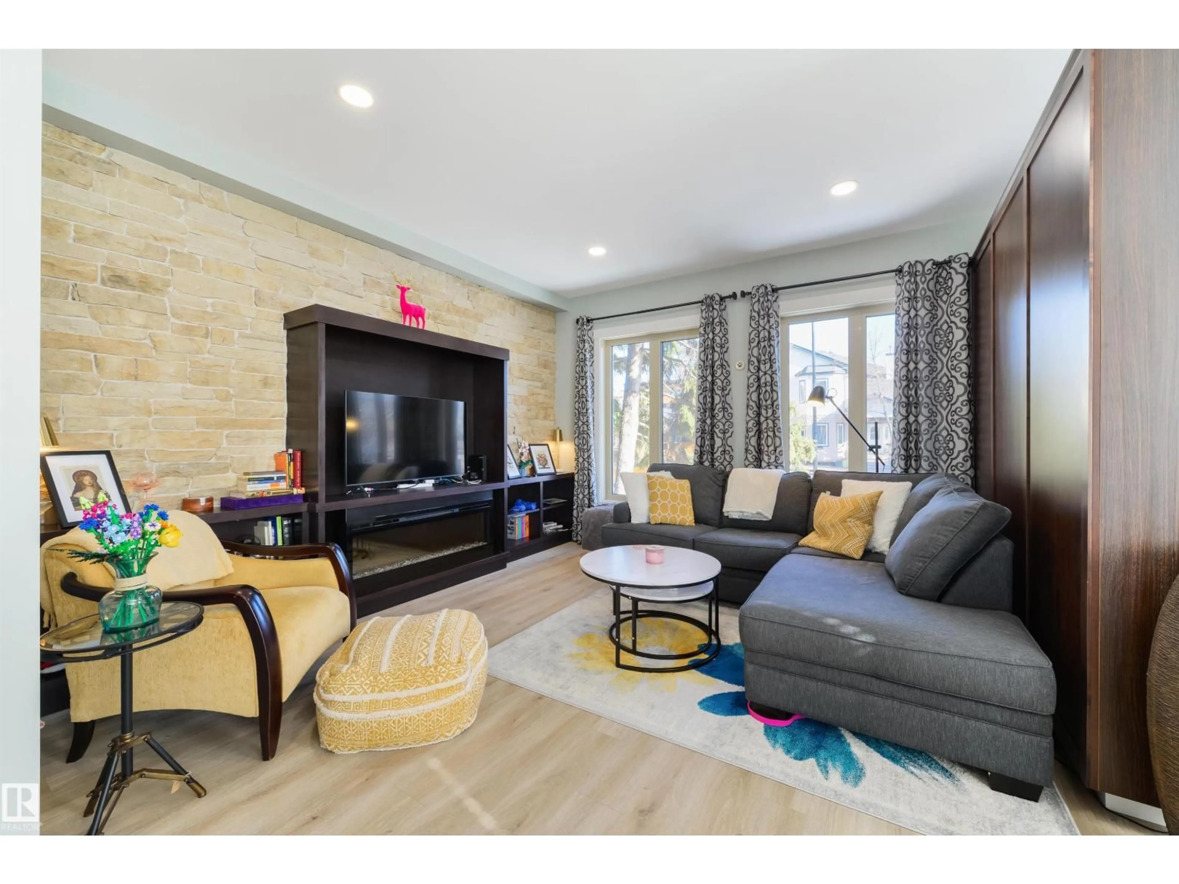 Living room with furniture, unknown for 14419 104 AV, Edmonton Alberta T5N2X8