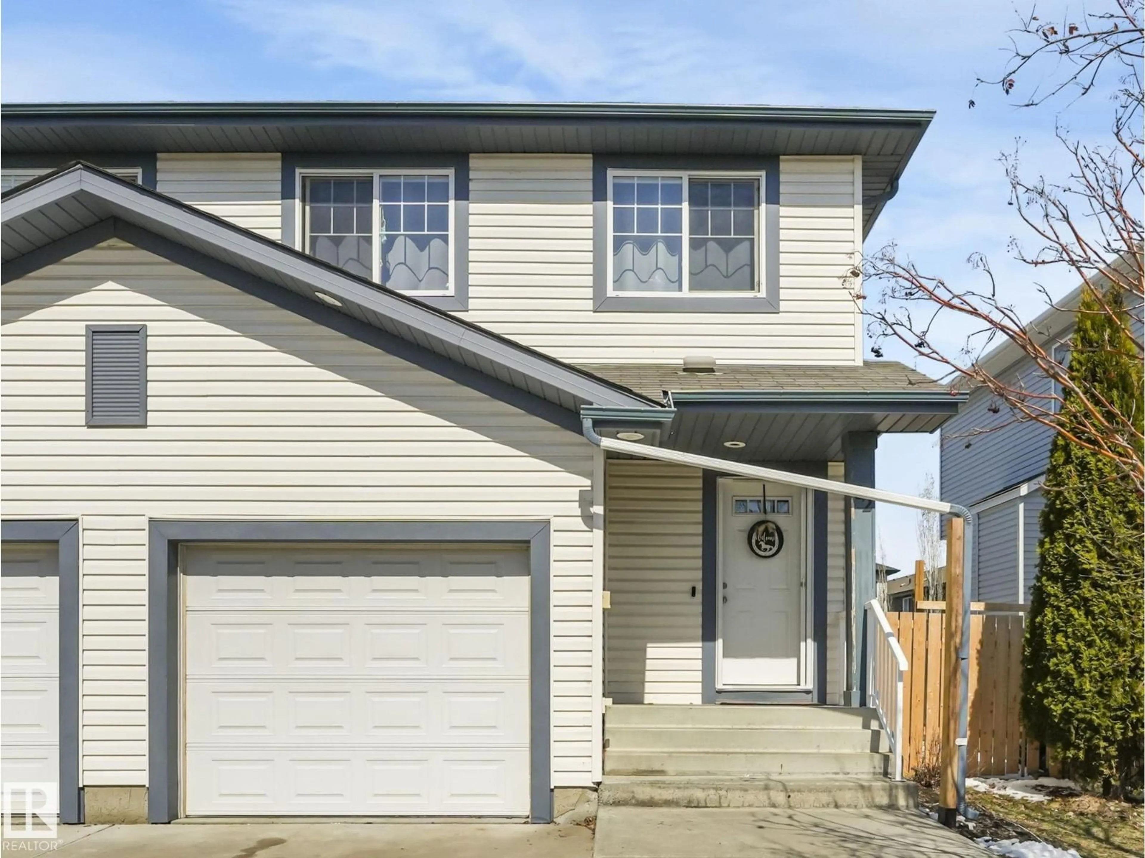 Home with vinyl exterior material, street for 32 CARAGANA WY, Fort Saskatchewan Alberta T8L0H8