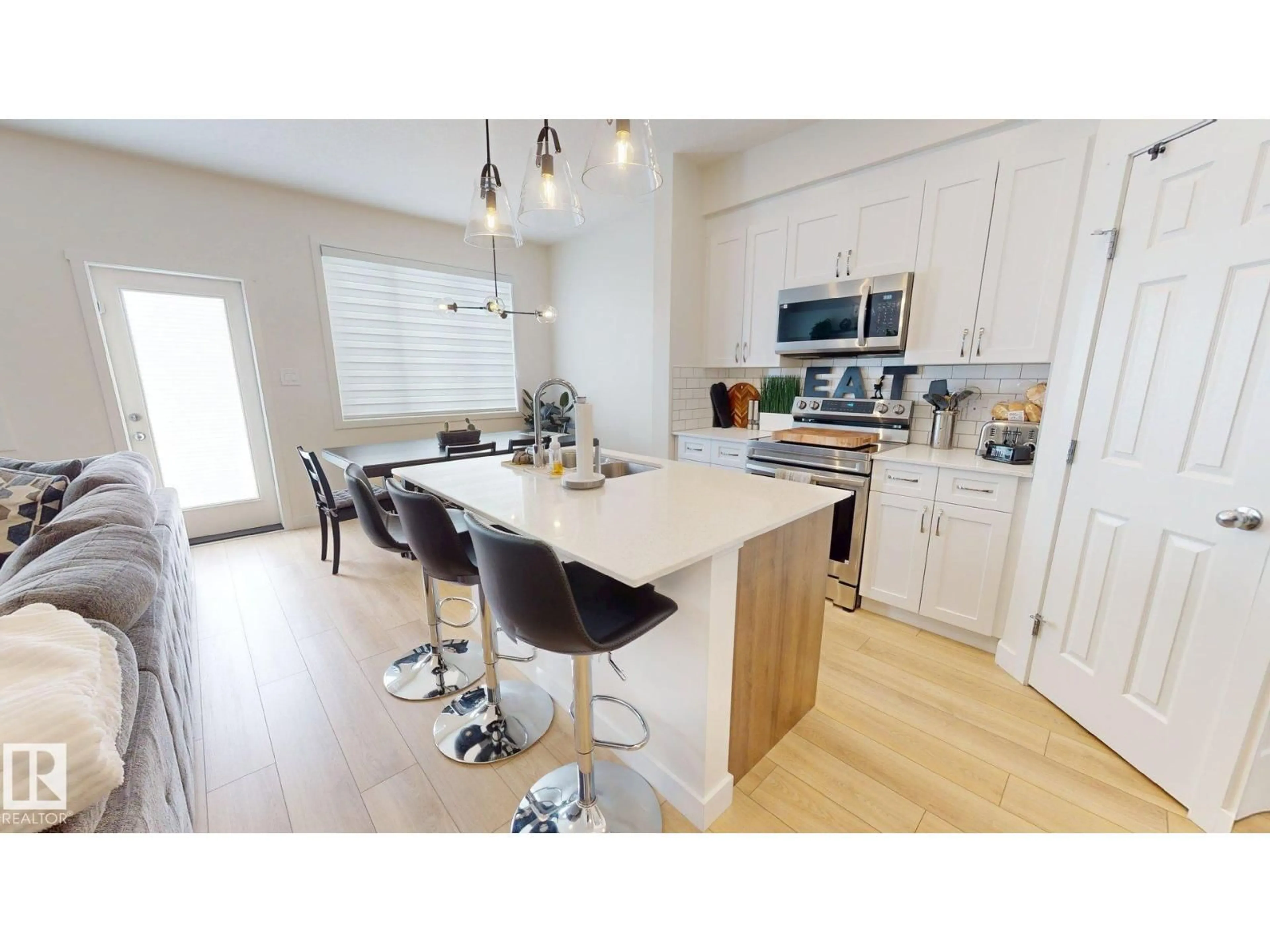 Open concept kitchen, wood/laminate floor for 8723 183 AV, Edmonton Alberta T5Z0G6