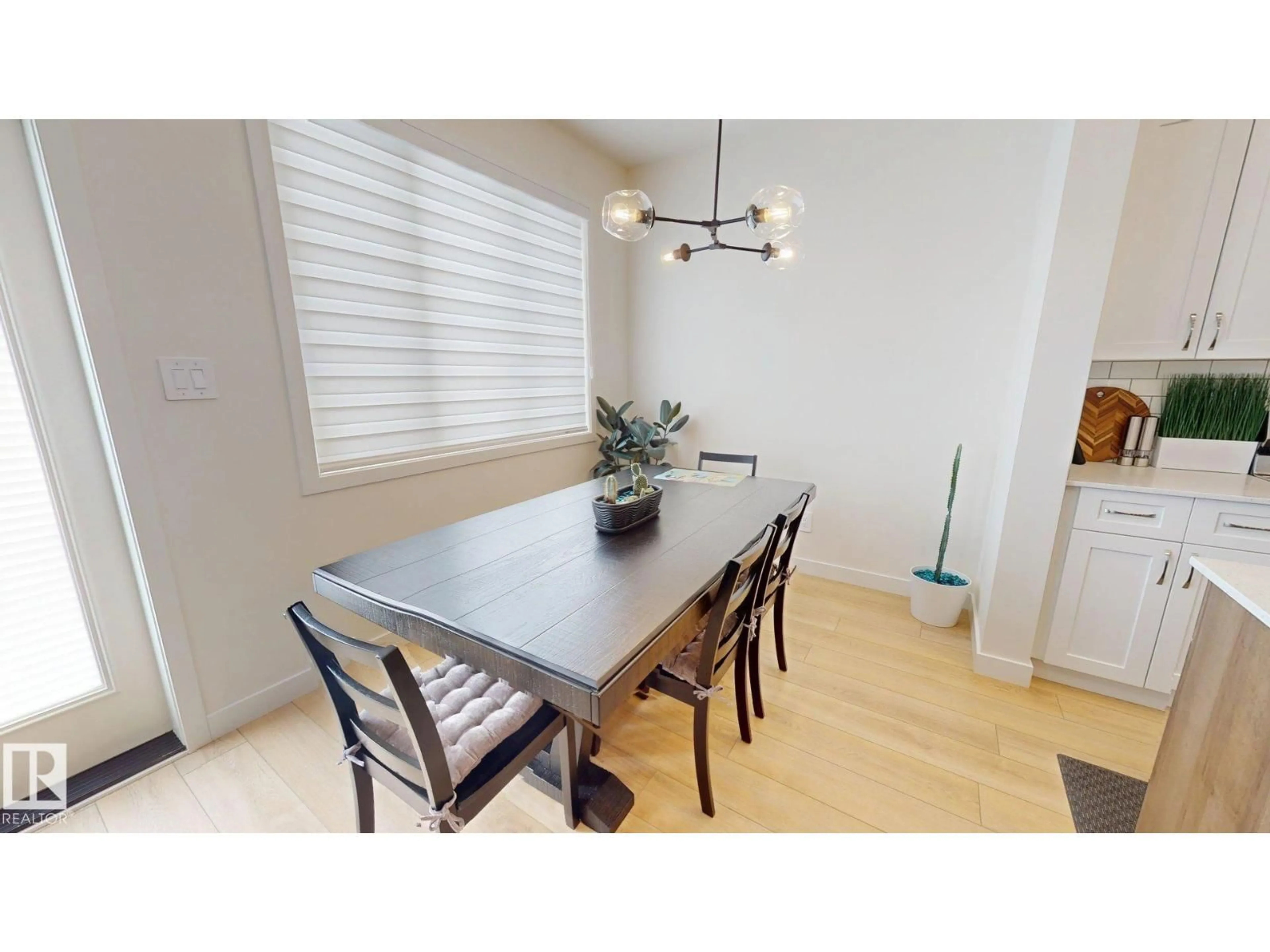 Dining room, wood/laminate floor for 8723 183 AV, Edmonton Alberta T5Z0G6
