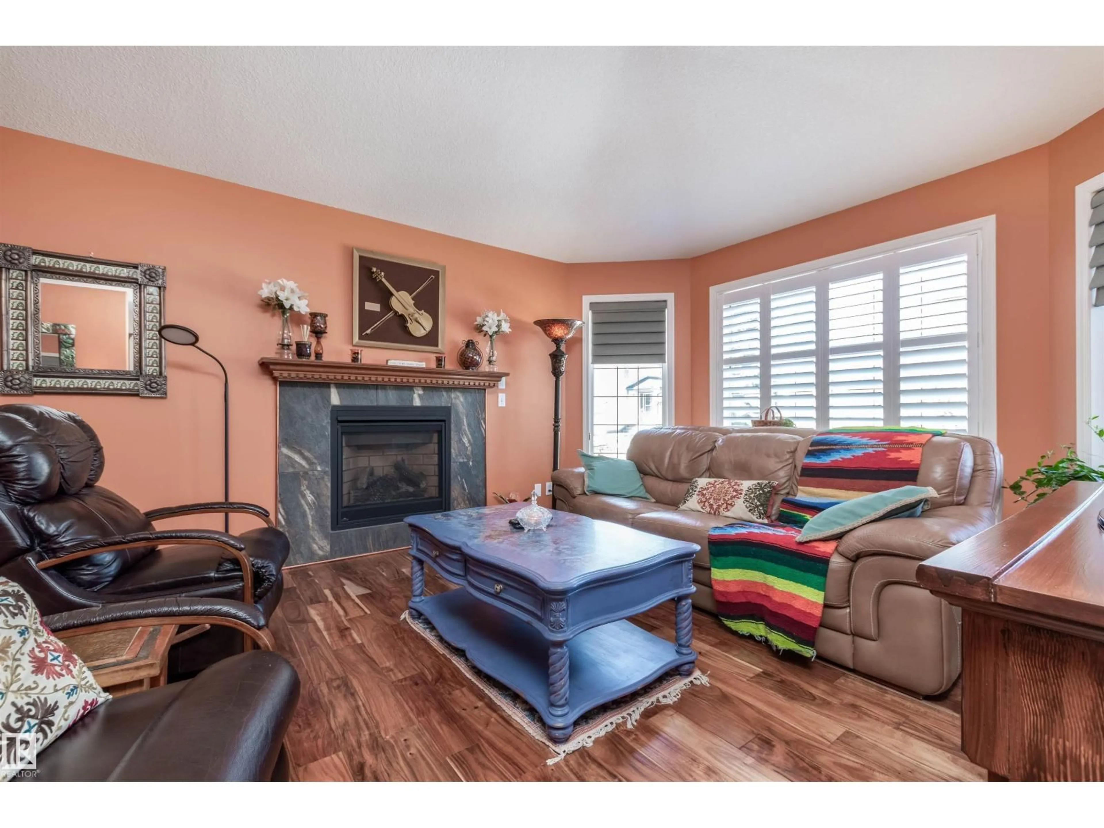 Living room with furniture, wood/laminate floor for 31 ESTATES CO, Sherwood Park Alberta T8B1M9