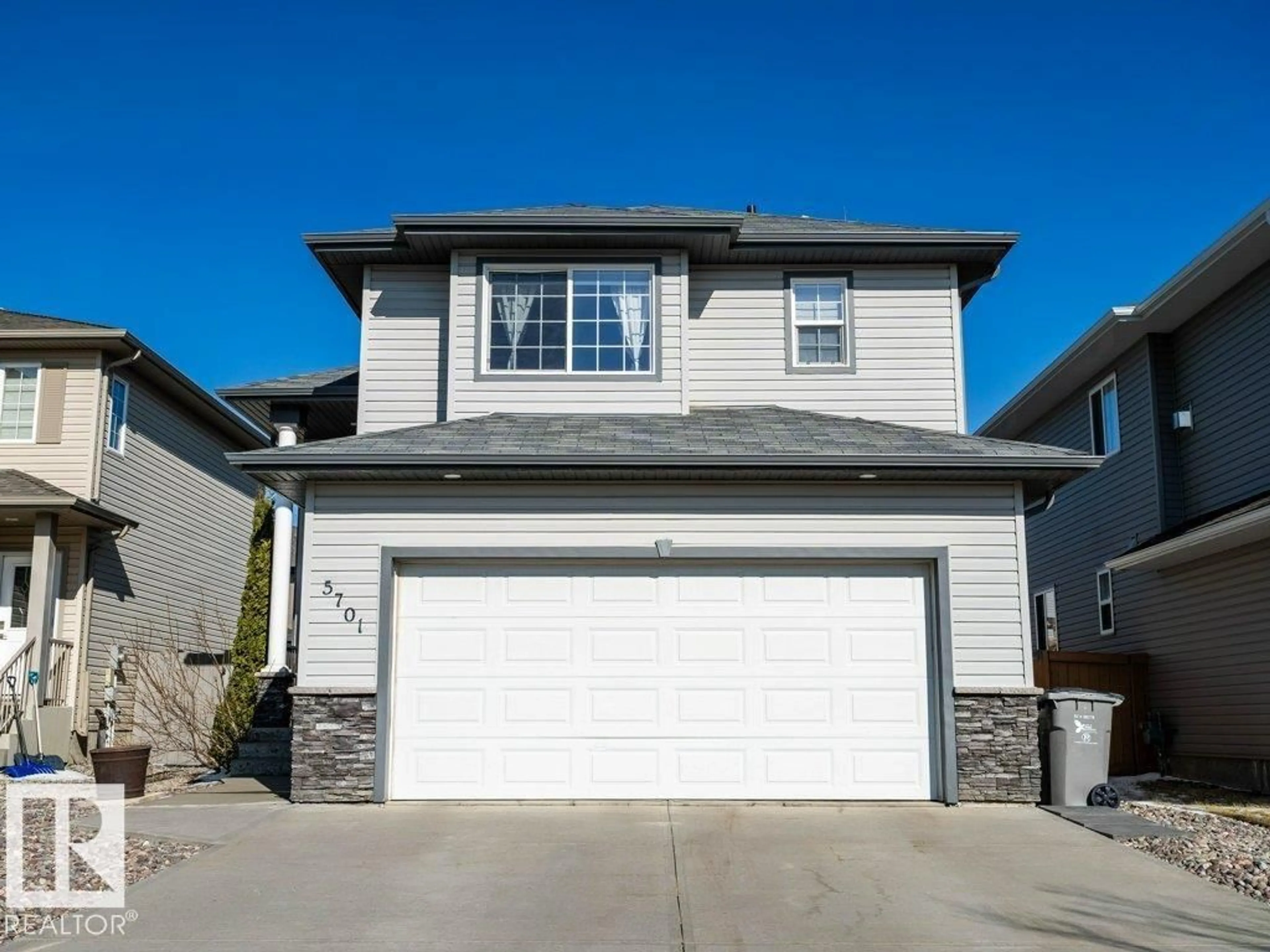 Home with vinyl exterior material, street for 5701 RUE EAGLEMONT, Beaumont Alberta T4X0G9
