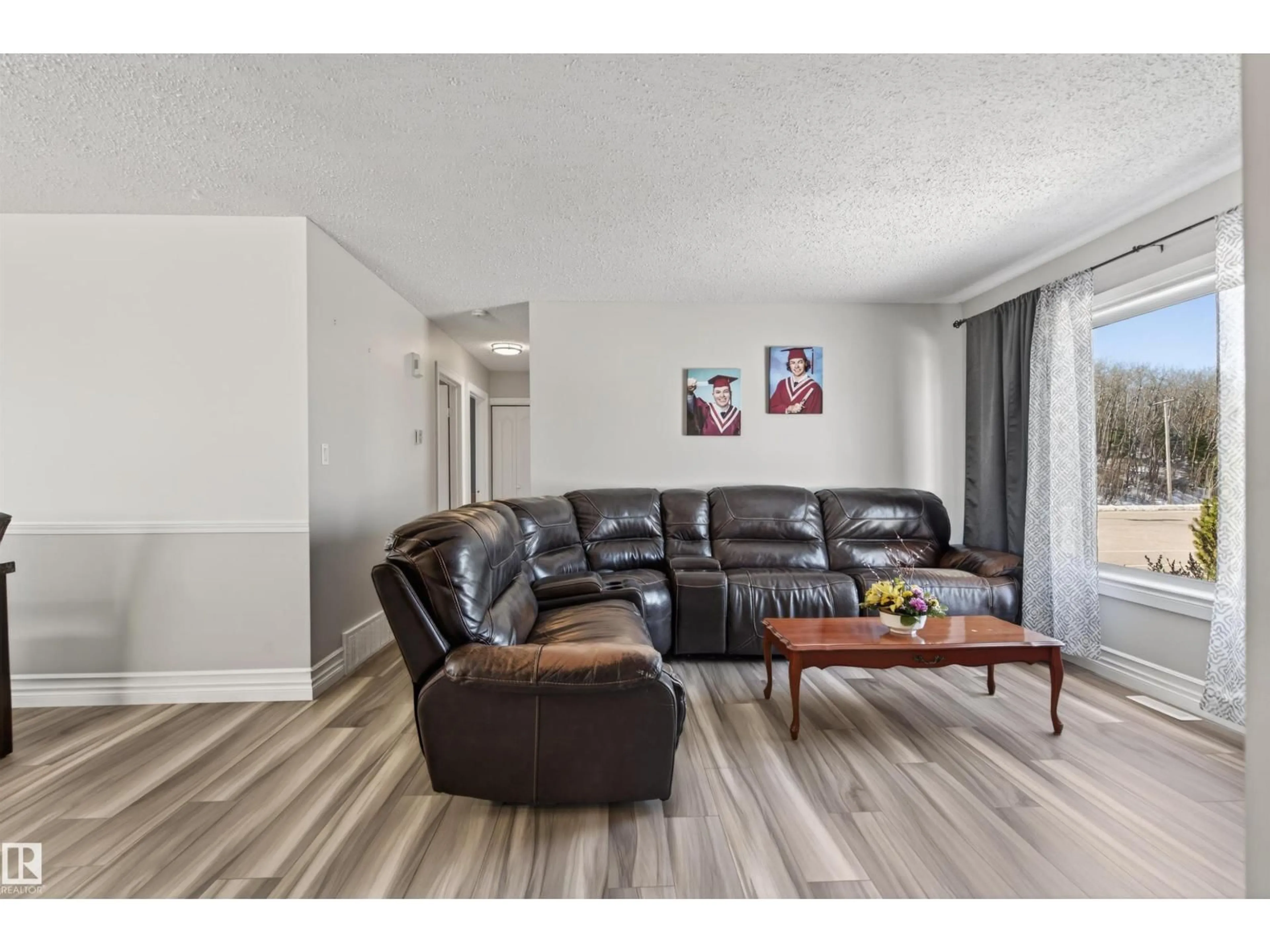 Living room with furniture, wood/laminate floor for 5003 38 ST, Cold Lake Alberta T9M2B2