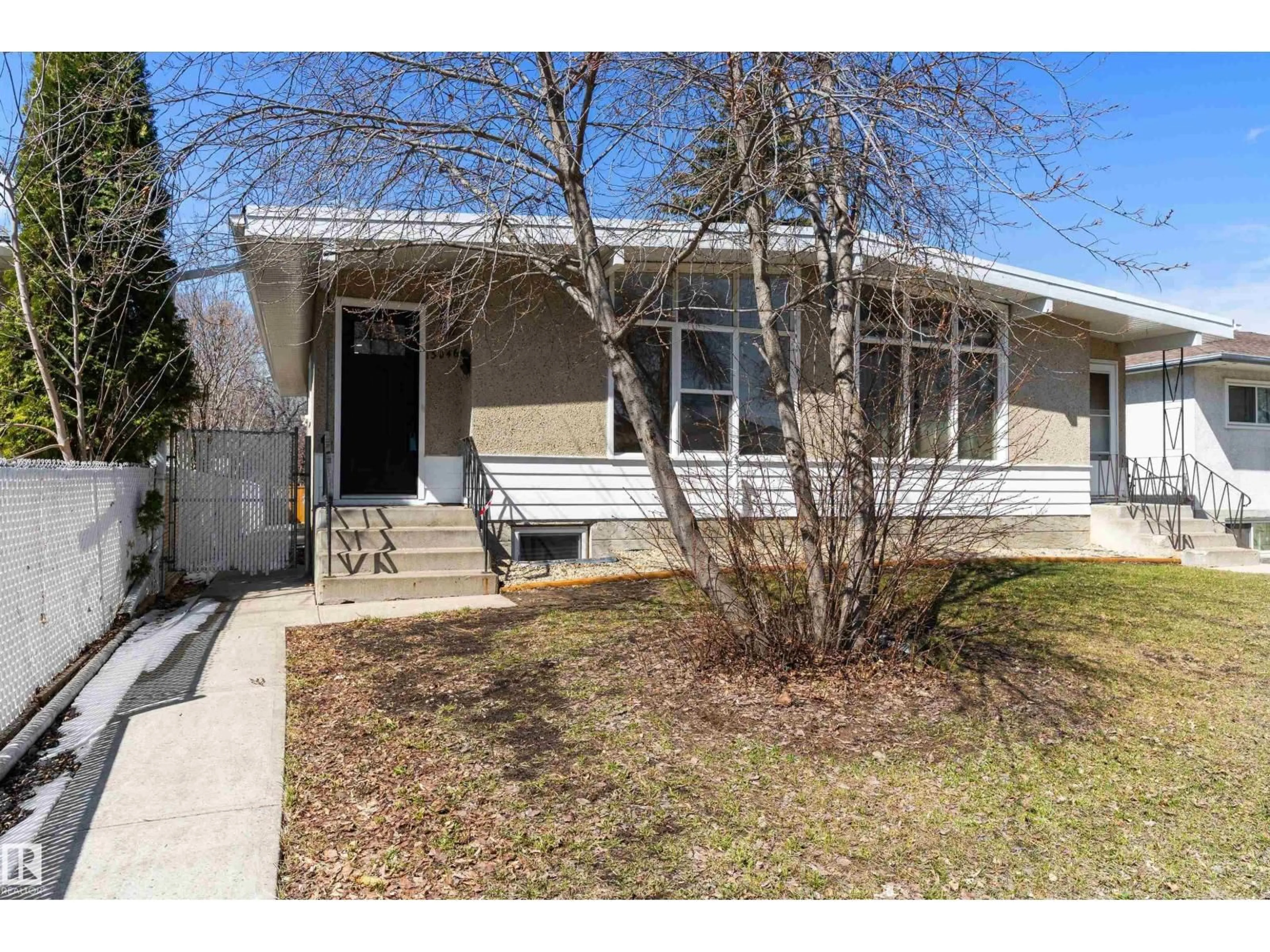 Home with vinyl exterior material, street for NW - 13046 101 ST, Edmonton Alberta T5E4E9