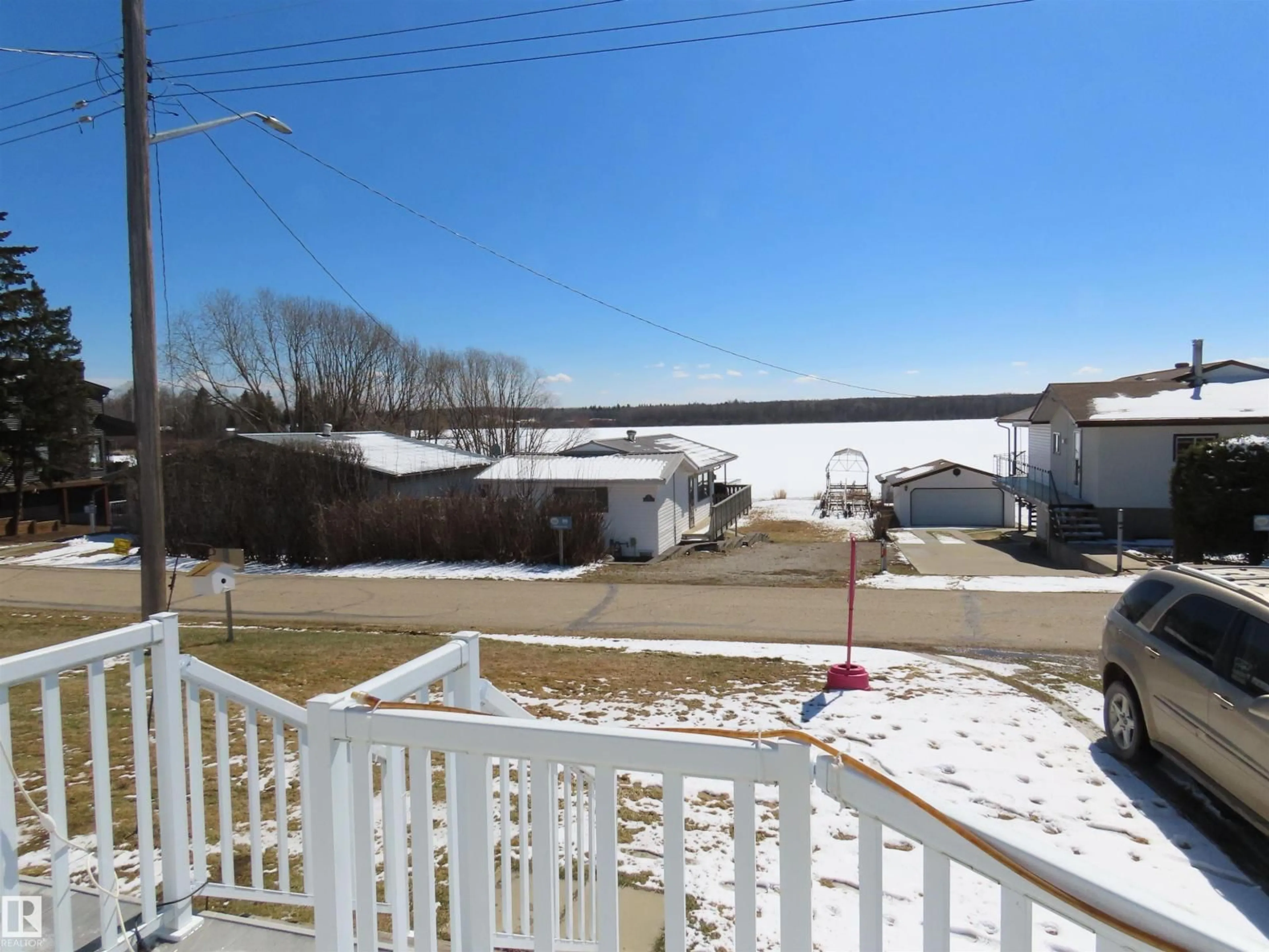 A pic from outside/outdoor area/front of a property/back of a property/a pic from drone, water/lake/river/ocean view for 98 LAKEVIEW DR, Rural Lac Ste. Anne County Alberta T0E1N0