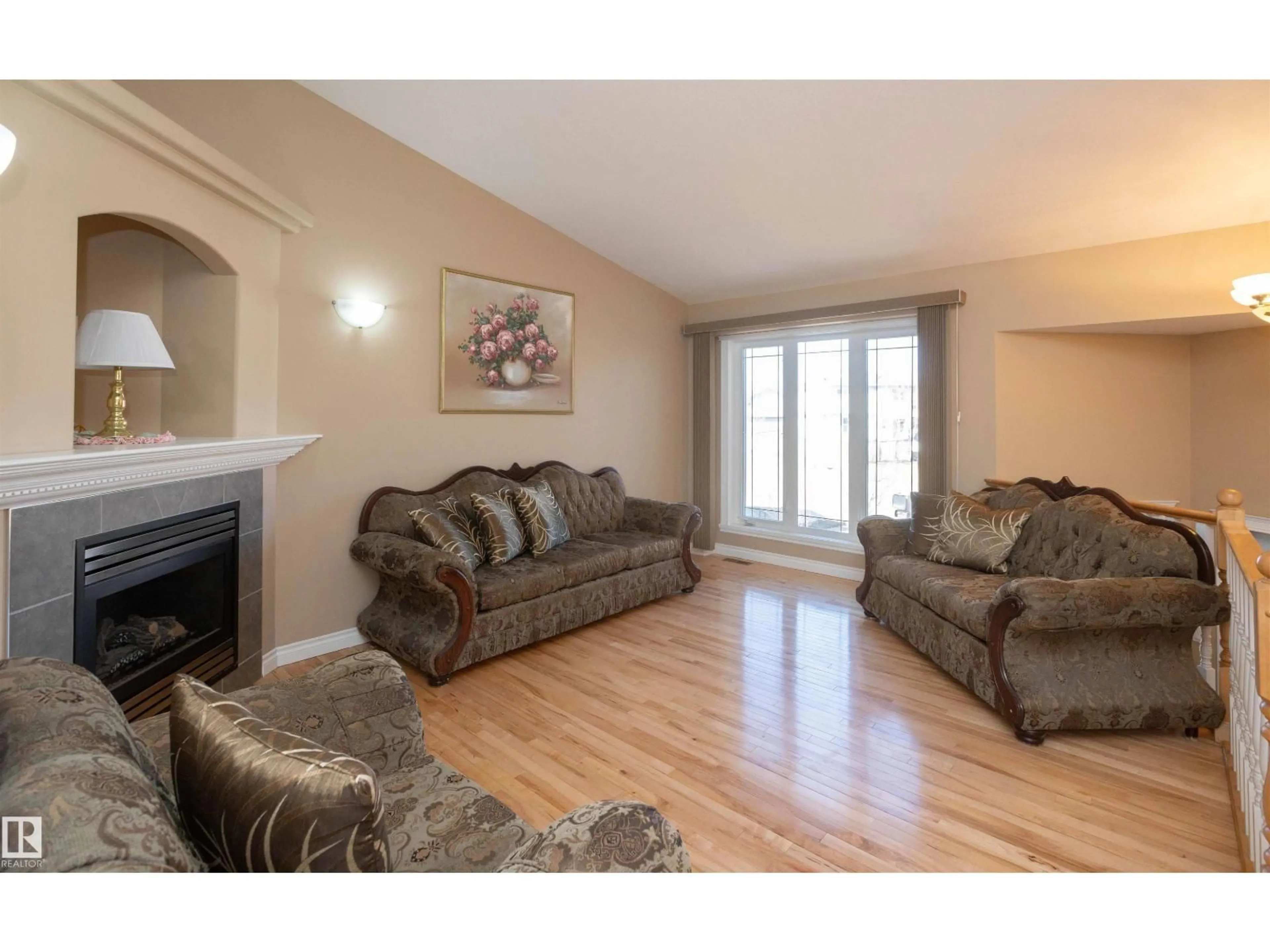 Living room with furniture, wood/laminate floor for 8008 96 STREET, Morinville Alberta T8R1W1
