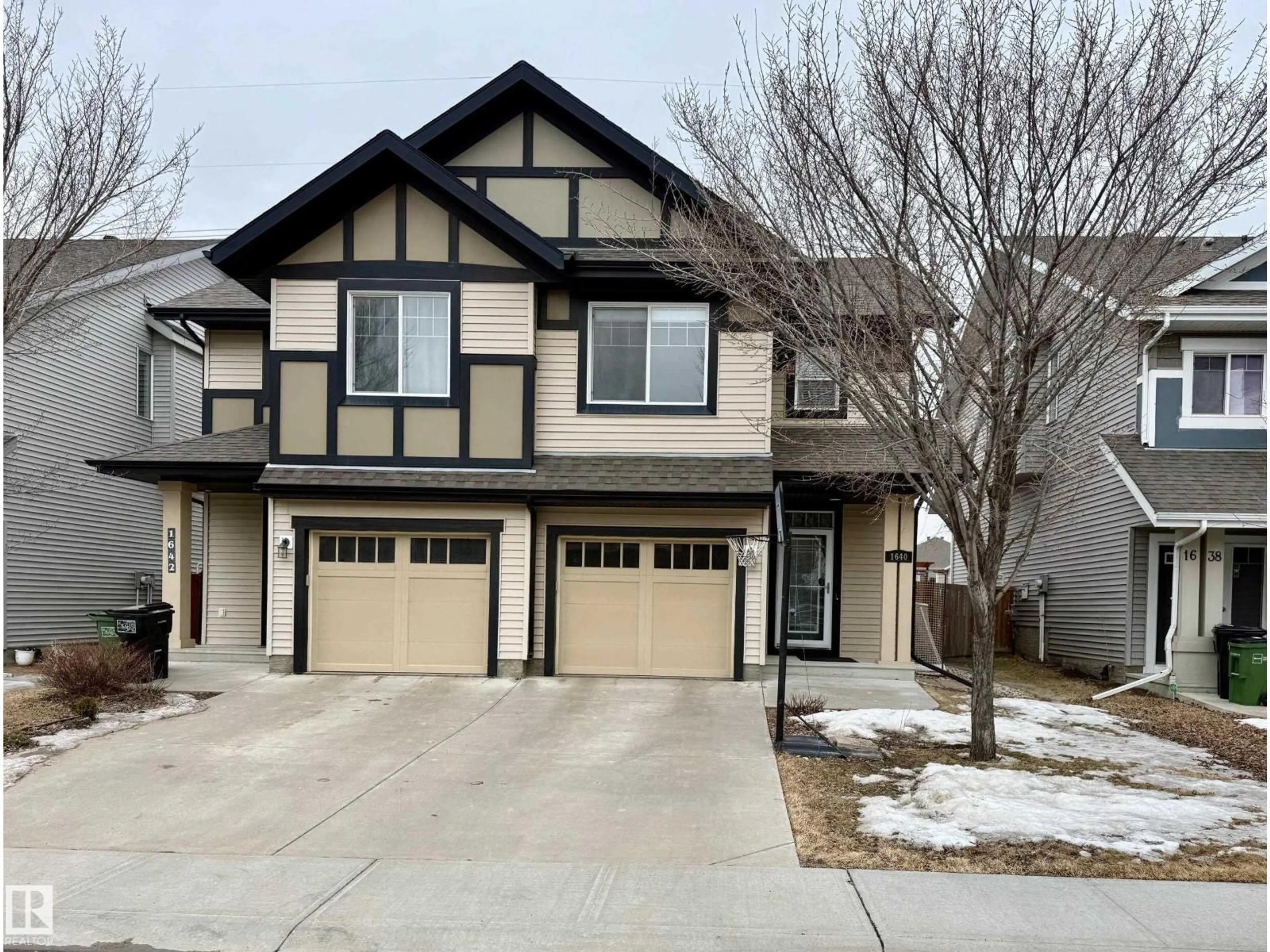 Home with vinyl exterior material, street for 1640 CHAPMAN WY, Edmonton Alberta T6W0Y5