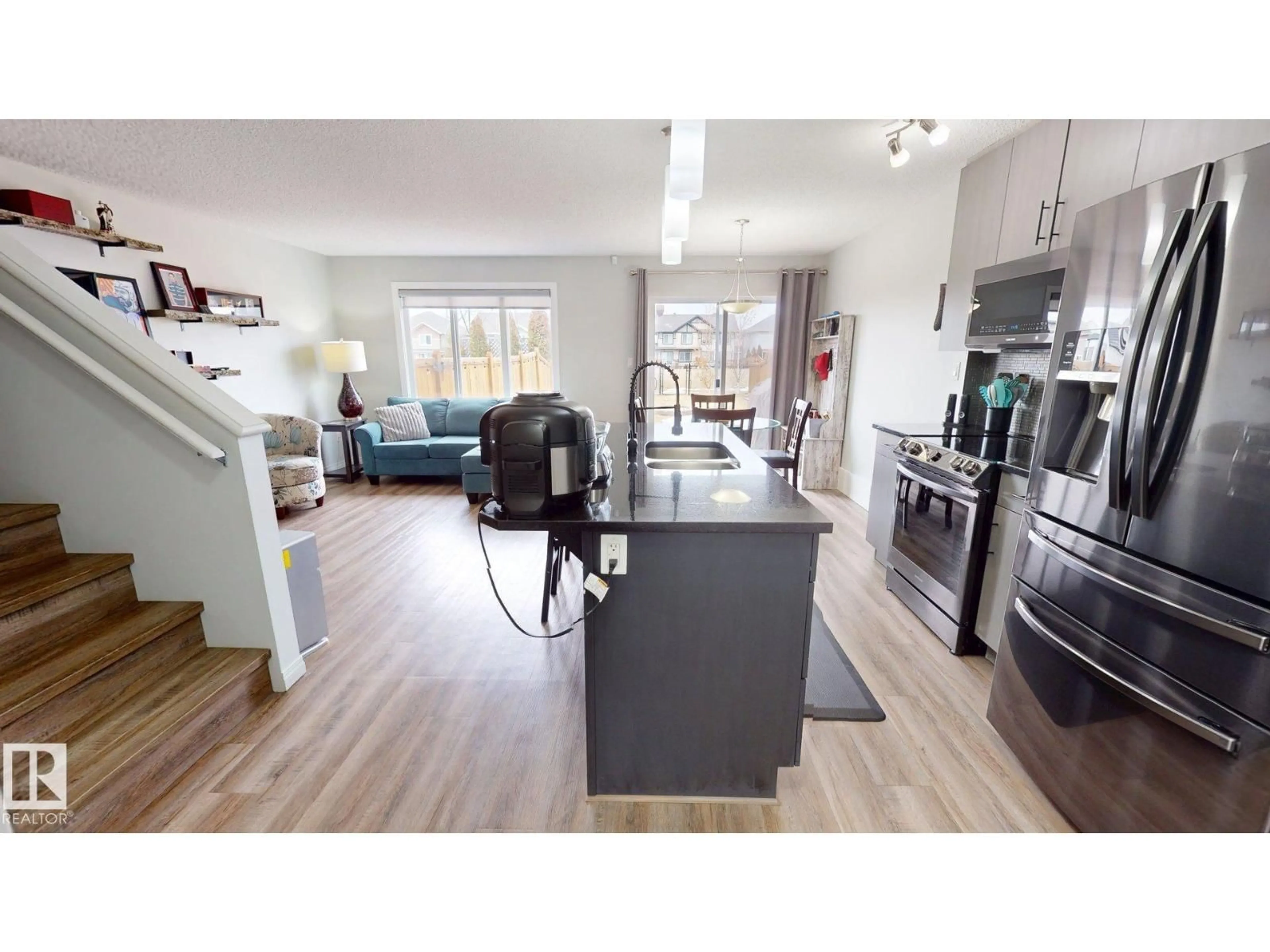 Open concept kitchen, wood/laminate floor for 1640 CHAPMAN WY, Edmonton Alberta T6W0Y5