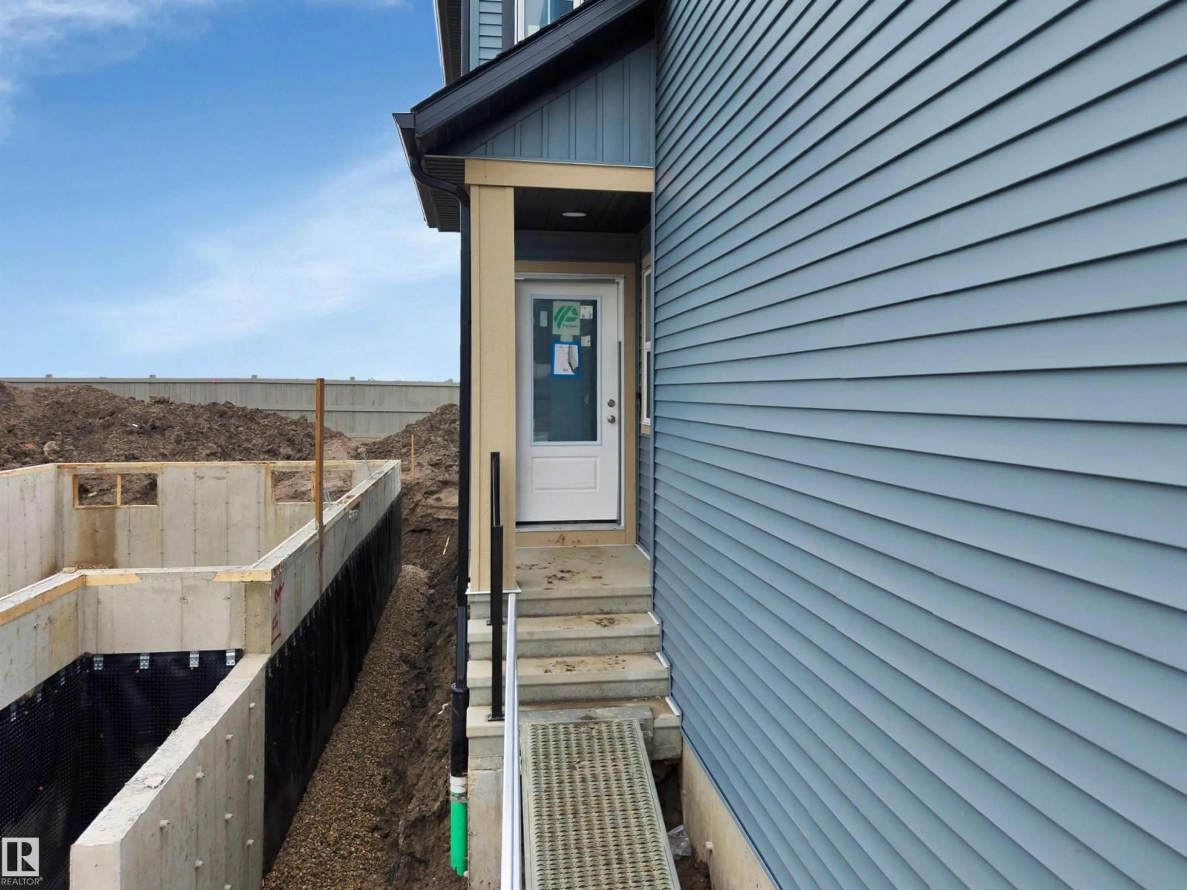 Home with vinyl exterior material, street for 18003 73 ST NW, Edmonton Alberta T5Z0W7