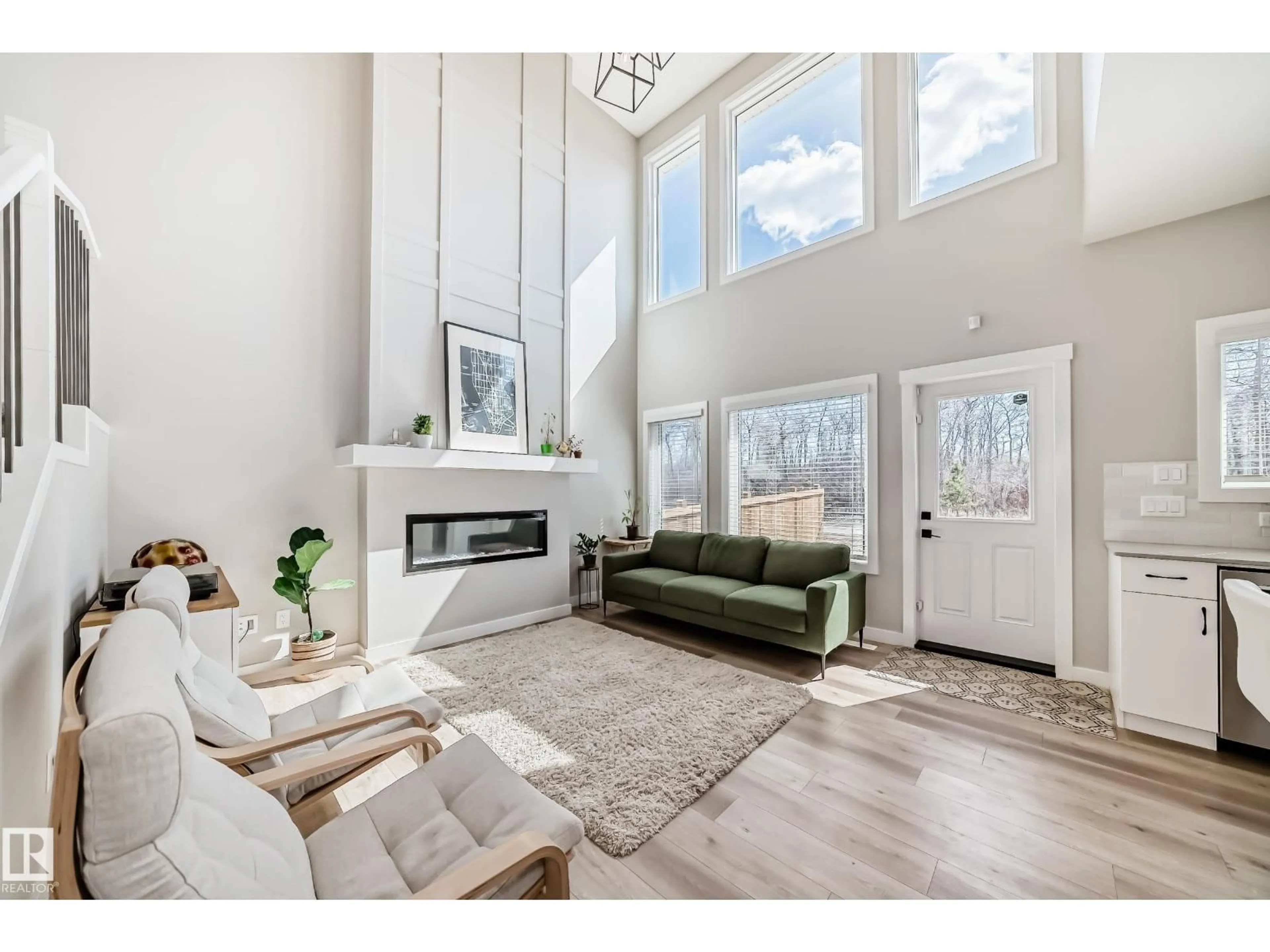 Living room with furniture, wood/laminate floor for 6259 175 AV, Edmonton Alberta T5Y0T4