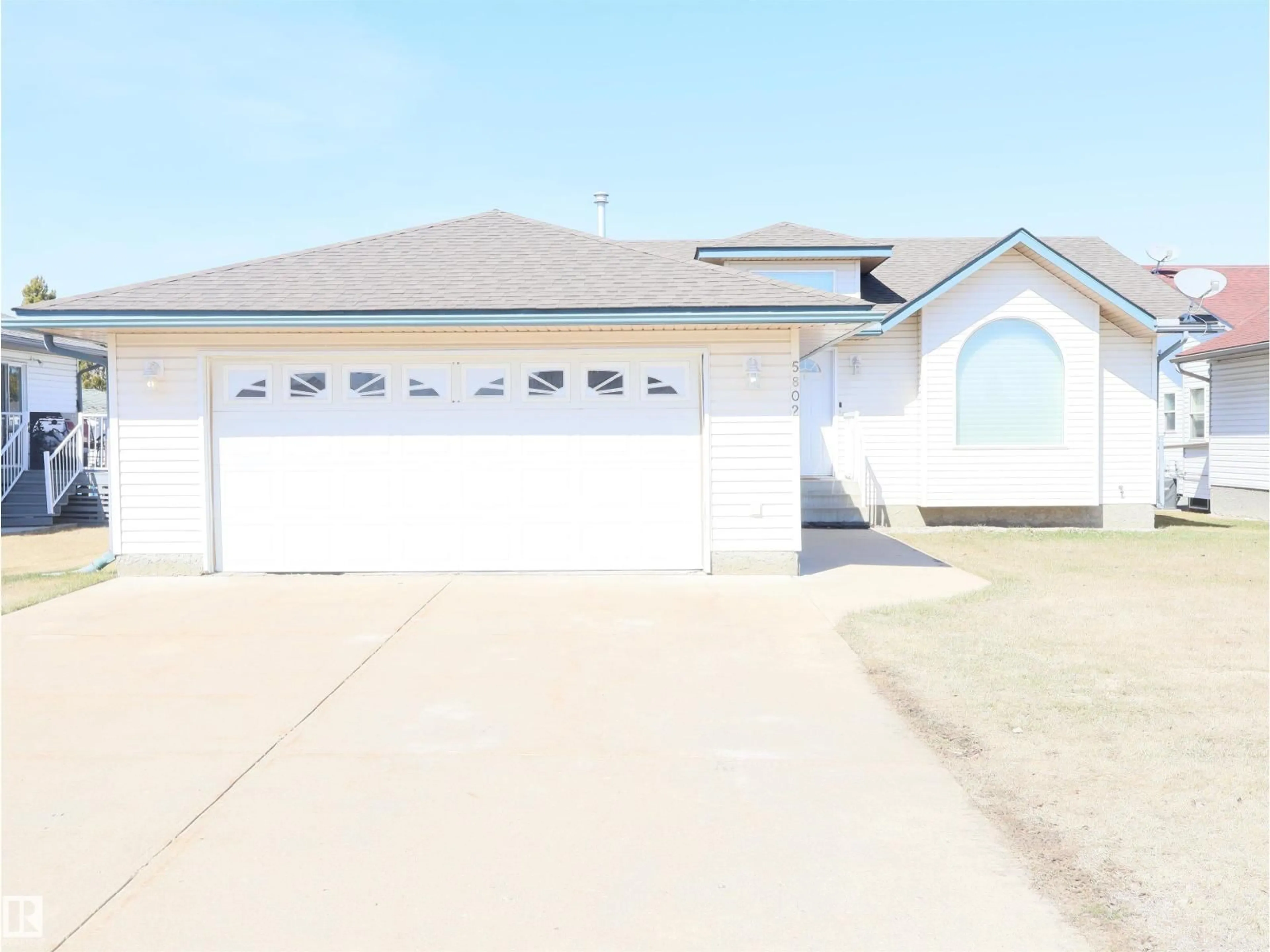 Home with vinyl exterior material, street for 5802 52 AV, Barrhead Alberta T7N1N6