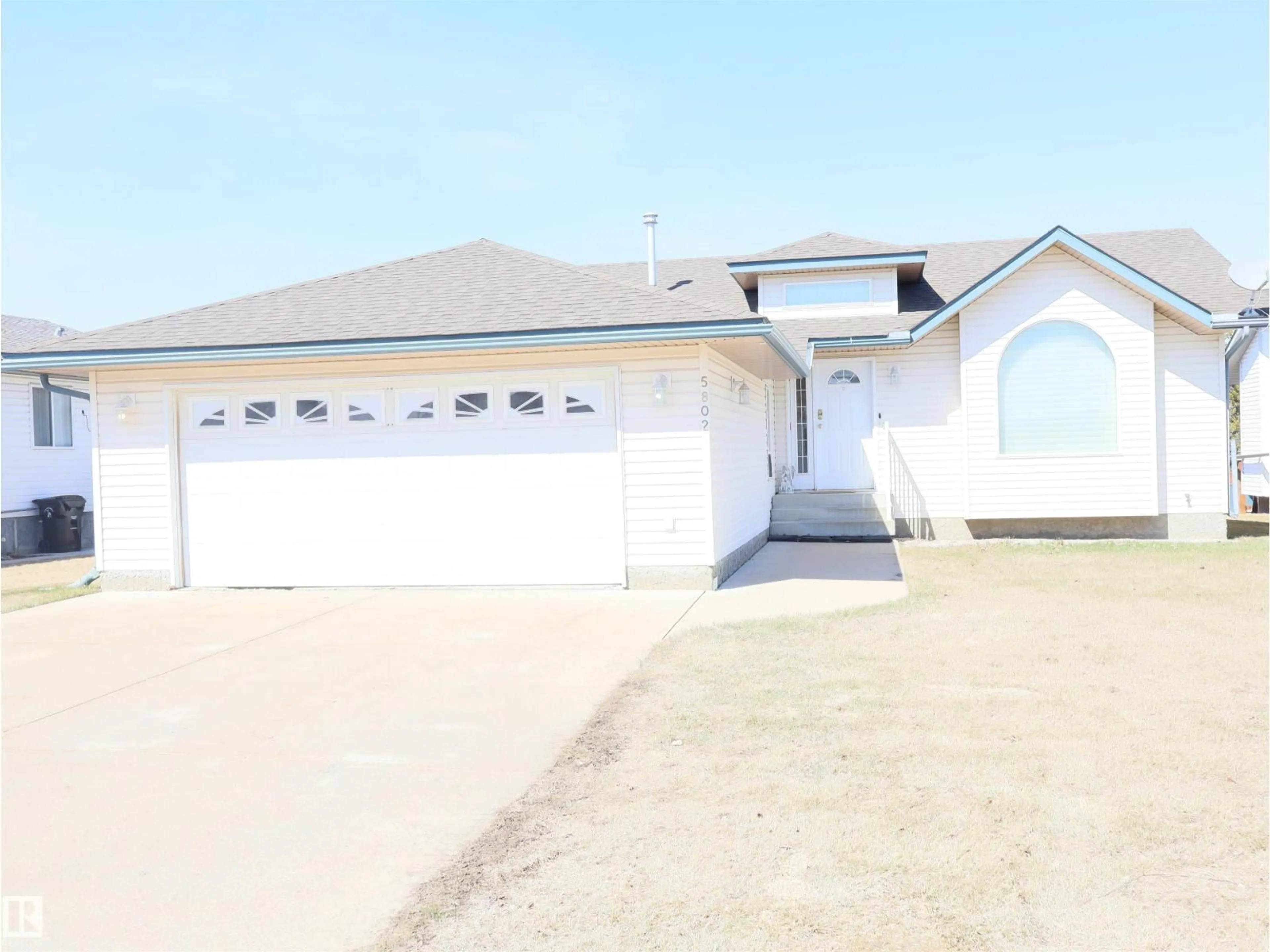 Home with vinyl exterior material, street for 5802 52 AV, Barrhead Alberta T7N1N6