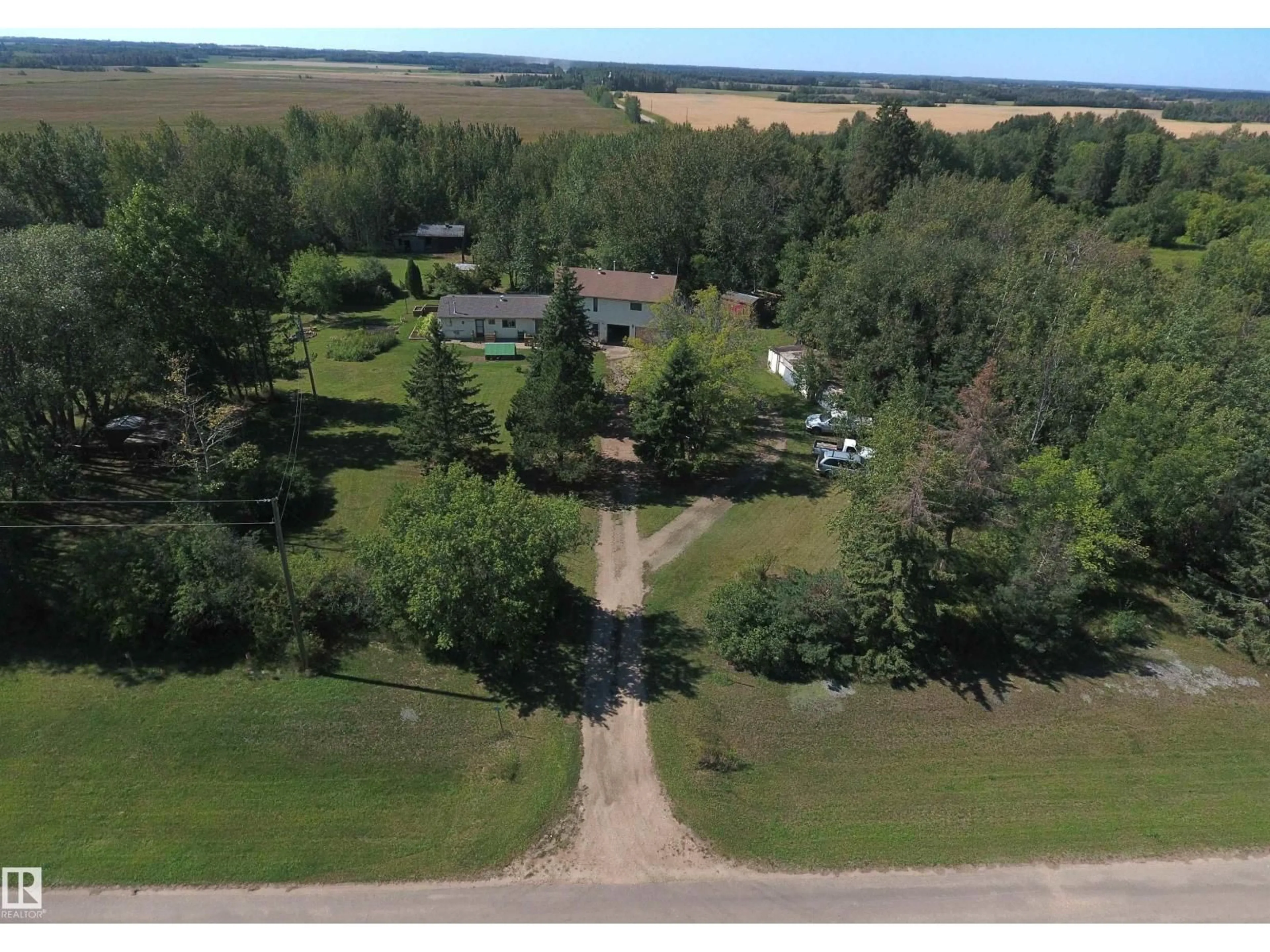 A pic from outside/outdoor area/front of a property/back of a property/a pic from drone, water/lake/river/ocean view for 2 - 23429 TWP RD 584, Rural Westlock County Alberta T0G1L0