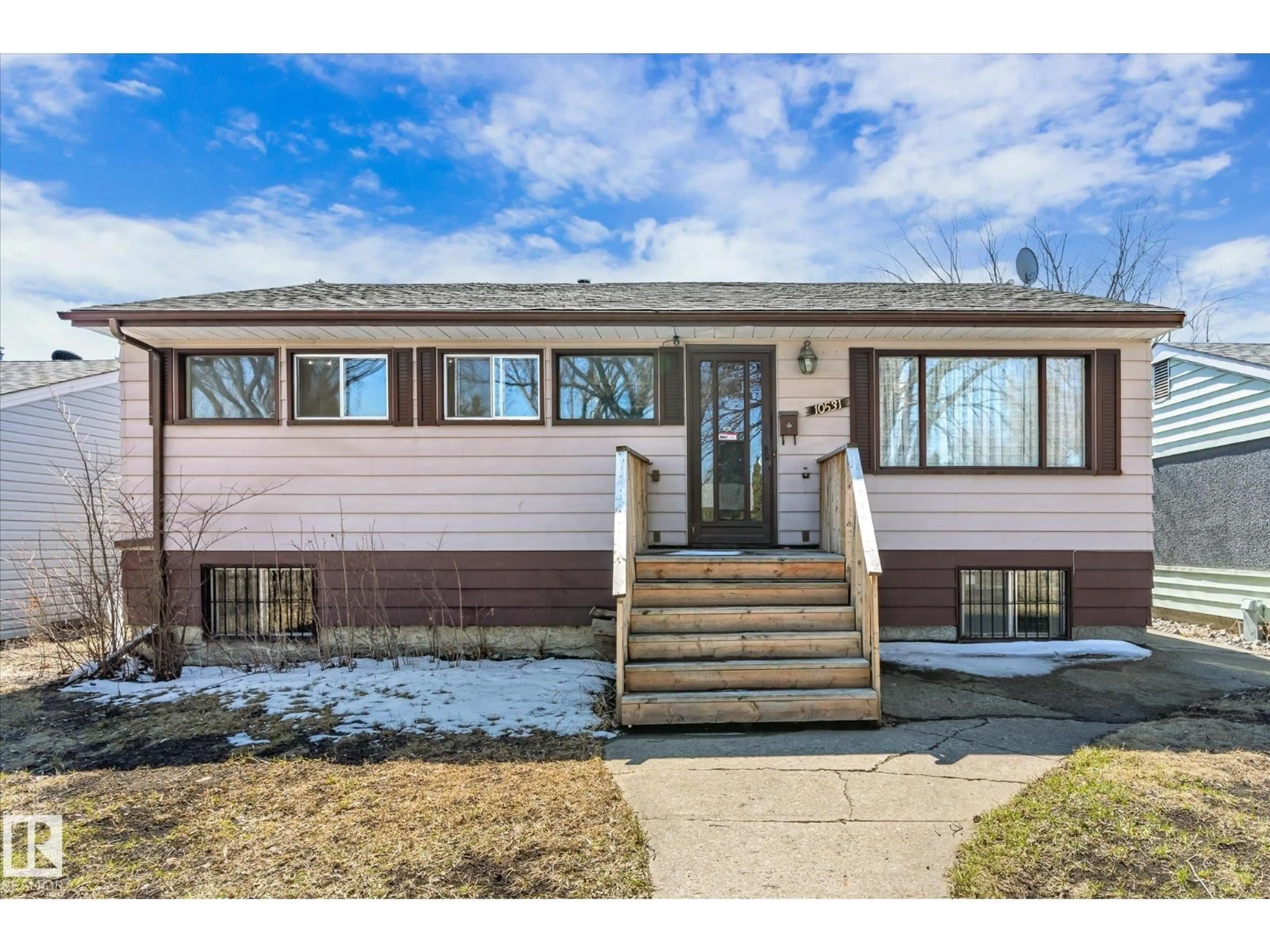 Home with vinyl exterior material, street for 10531 128 AV, Edmonton Alberta T5E0J2