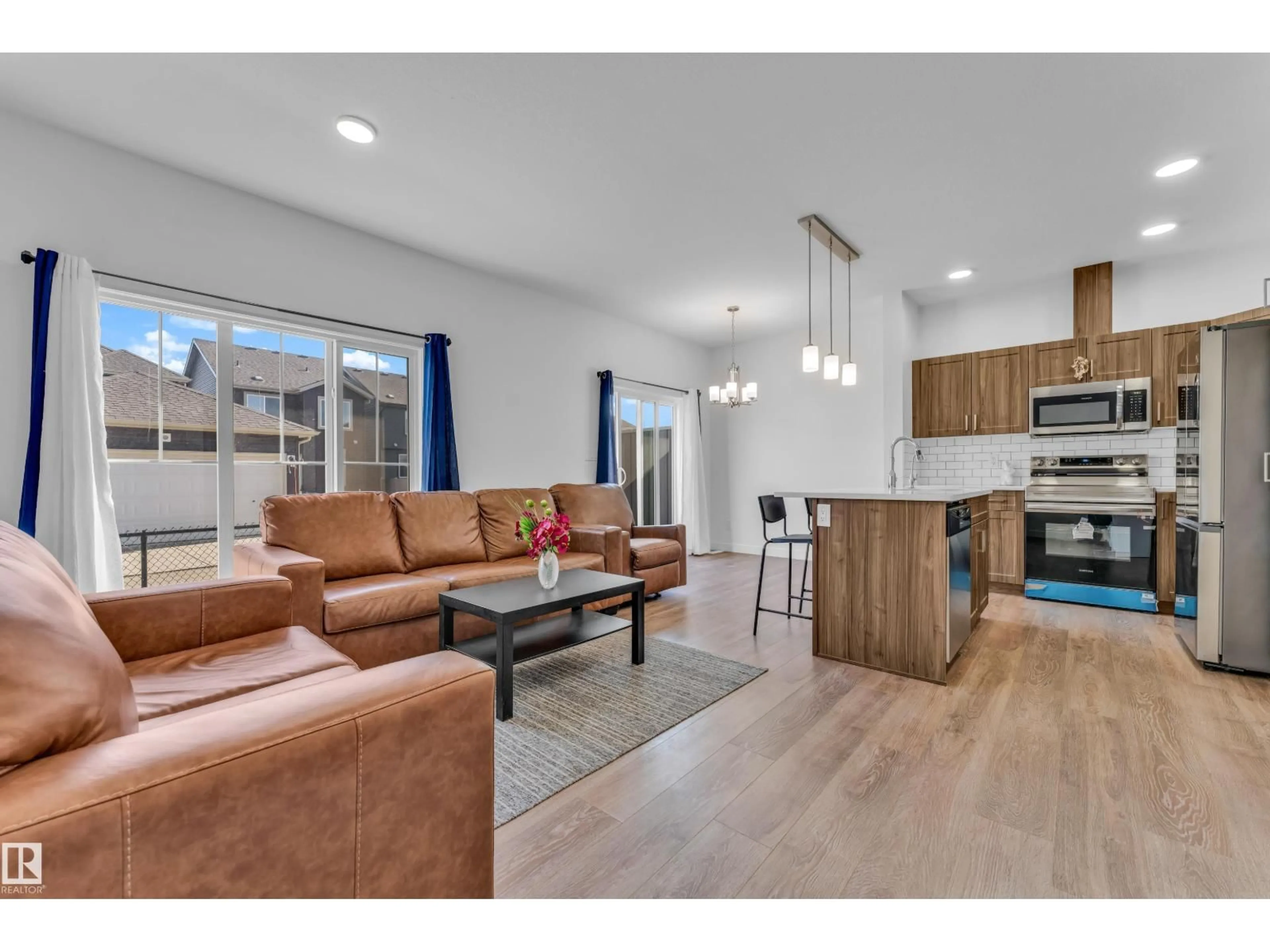 Open concept kitchen, wood/laminate floor for #41 - 603 ORCHARDS BV, Edmonton Alberta T6X2W8