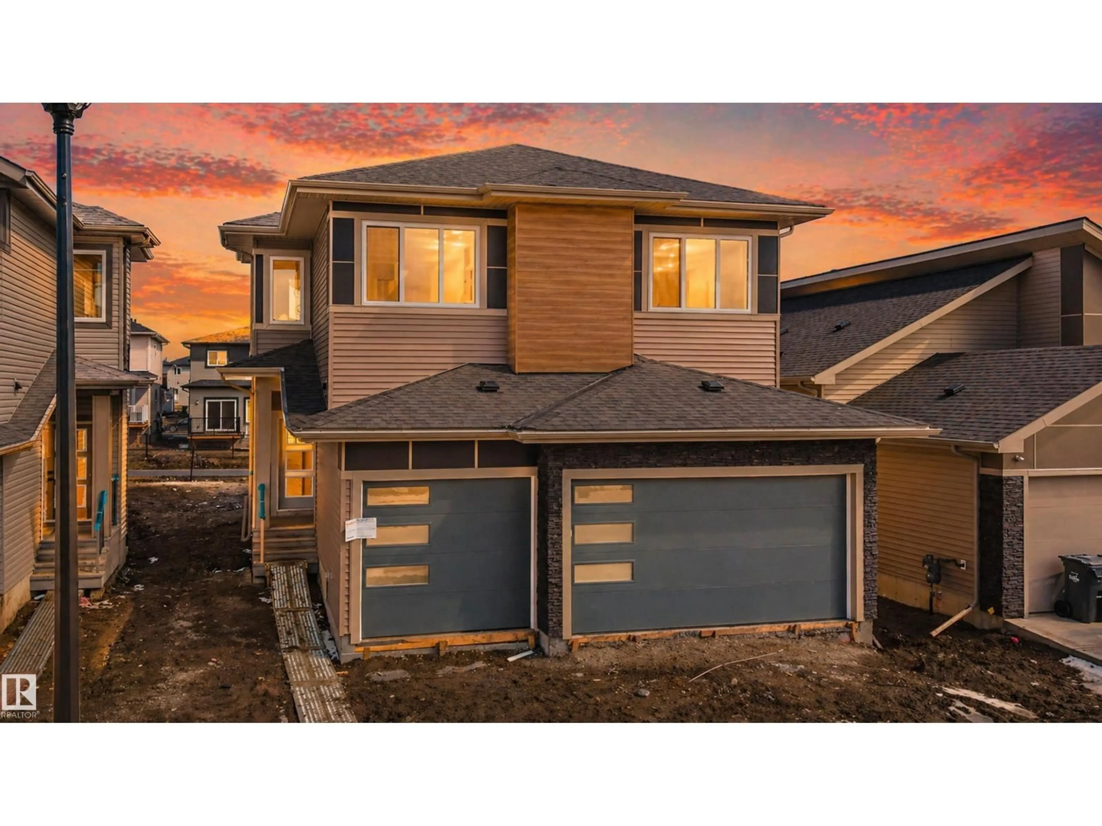 Home with vinyl exterior material, street for 203 BASIN CO, Leduc Alberta T9E1T6