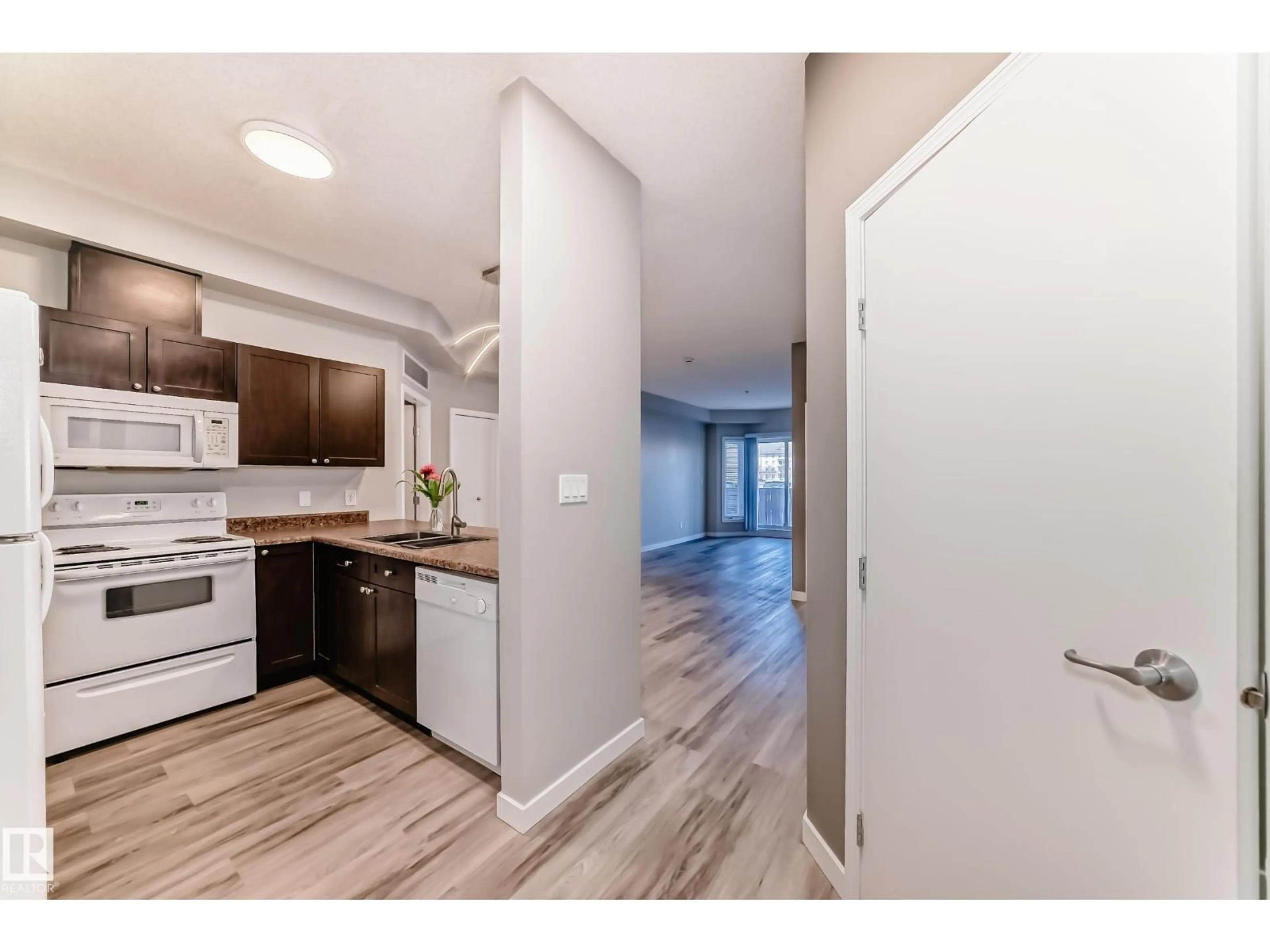 Open concept kitchen, wood/laminate floor for 105 - 4316 139 AV, Edmonton Alberta T5Y0L1