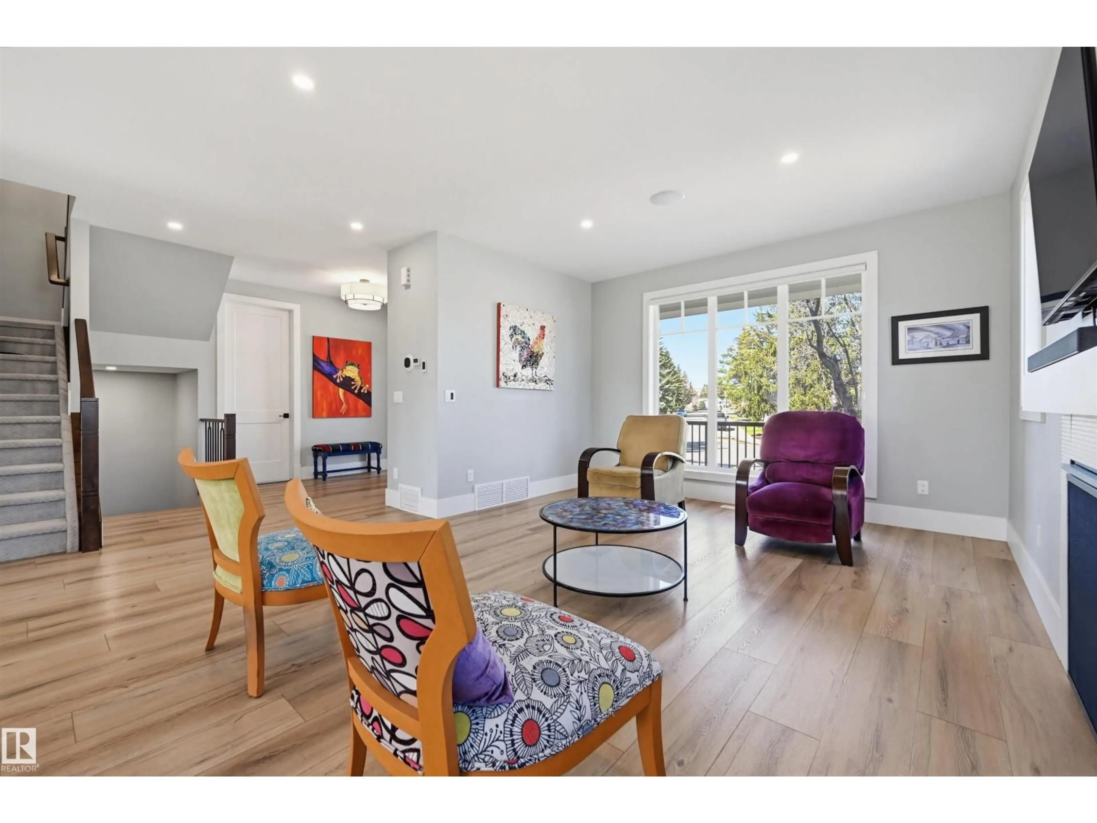 Living room with furniture, wood/laminate floor for 9005 144 ST, Edmonton Alberta T5R0R5