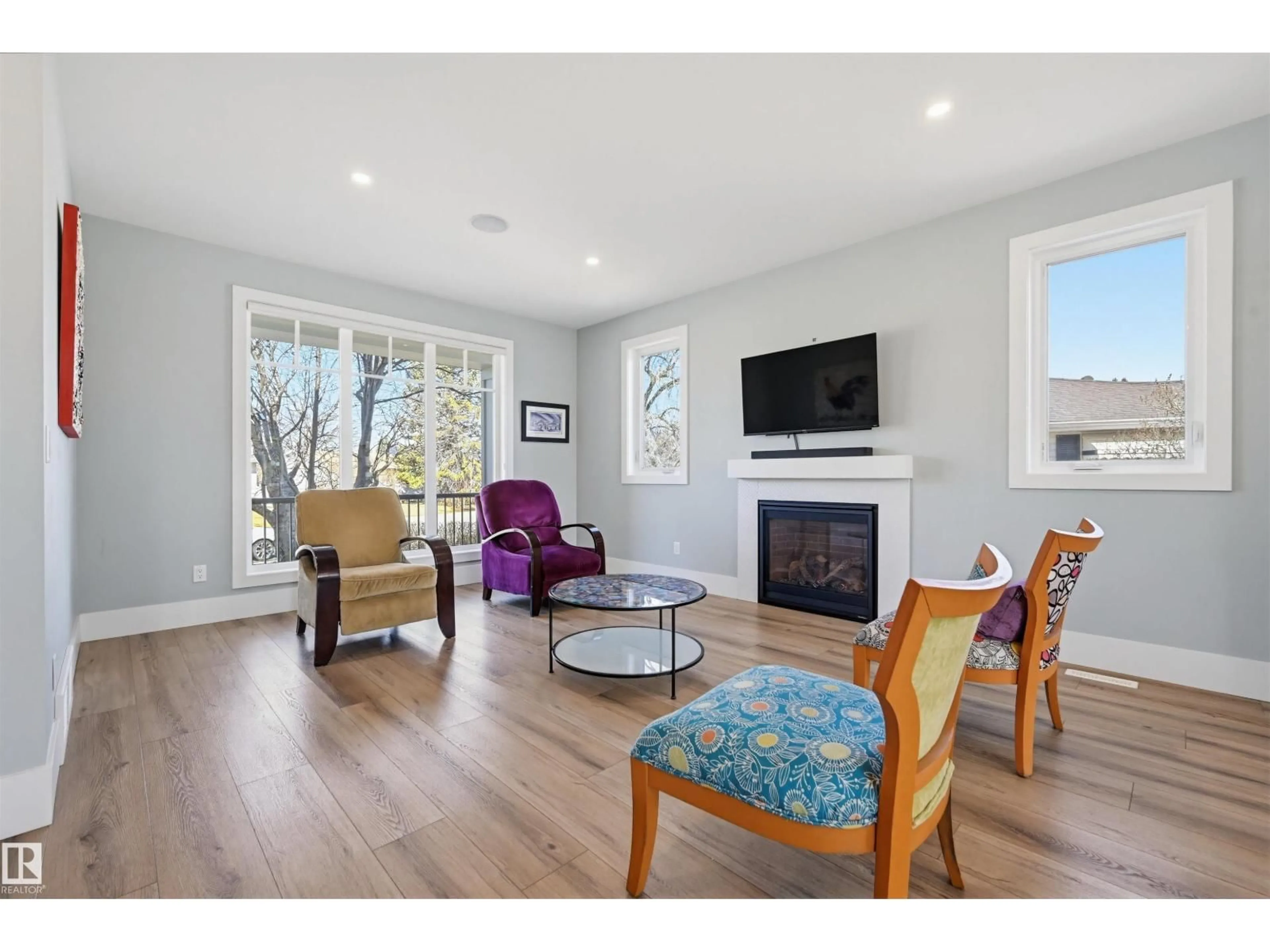 Living room with furniture, wood/laminate floor for 9005 144 ST, Edmonton Alberta T5R0R5