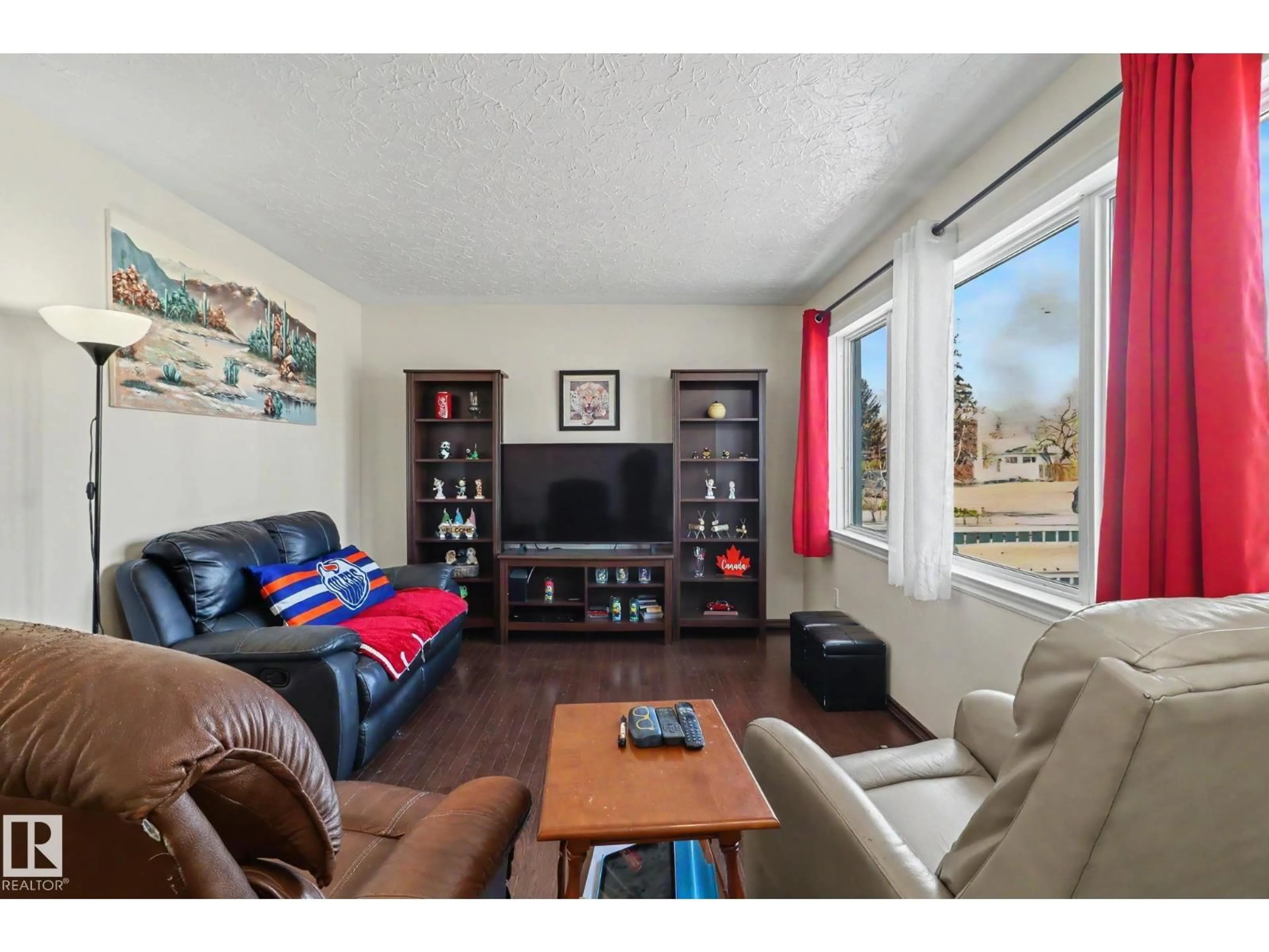 Living room with furniture, wood/laminate floor for NW - 16141 108 AV, Edmonton Alberta T5P4E3