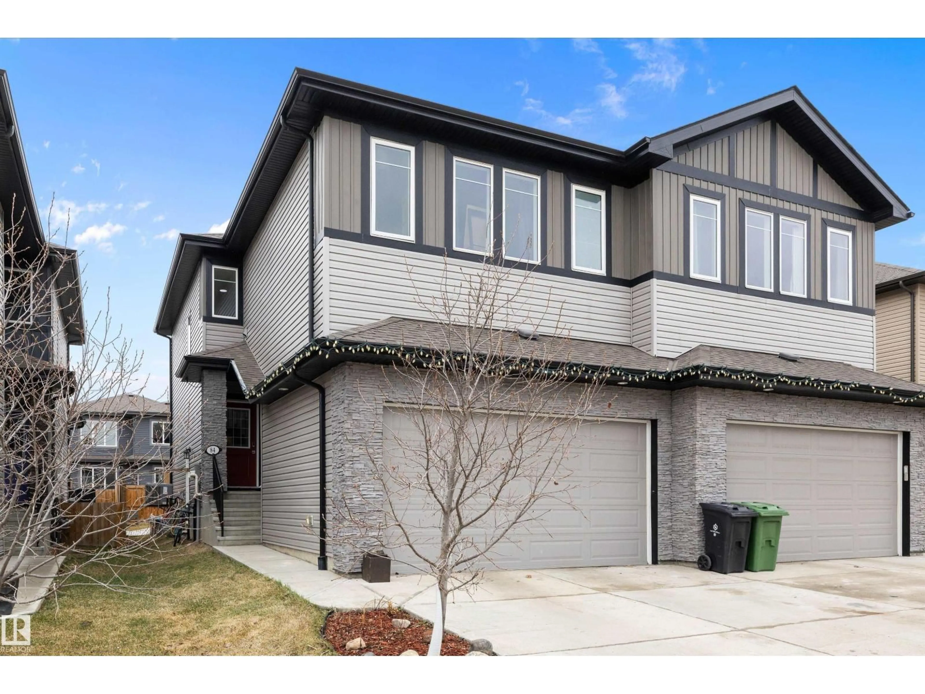 Home with vinyl exterior material, street for 84 WINGATE WY, Fort Saskatchewan Alberta T8L0W7