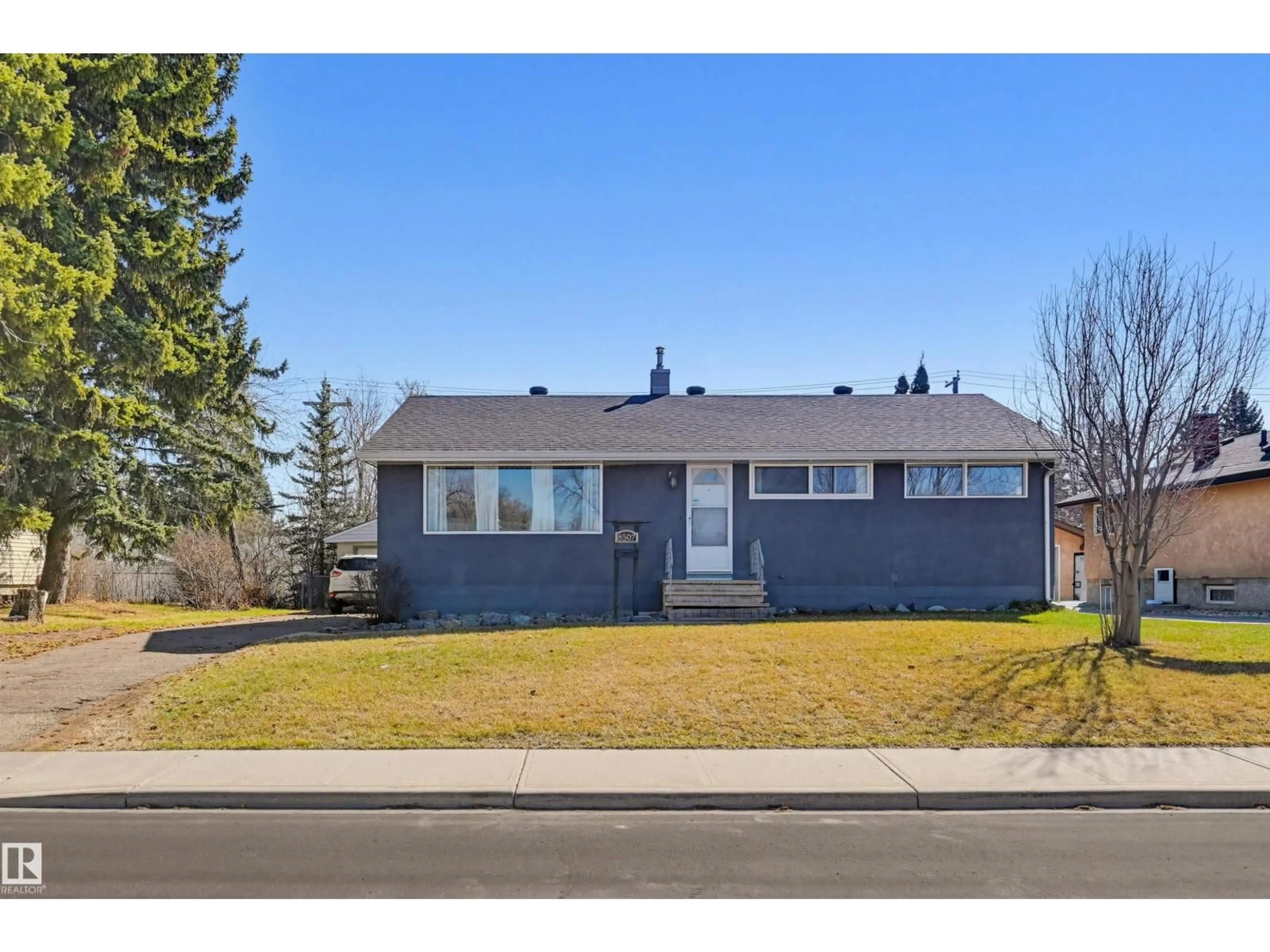 Home with vinyl exterior material, street for 8507 149 ST NW, Edmonton Alberta T5R1B3