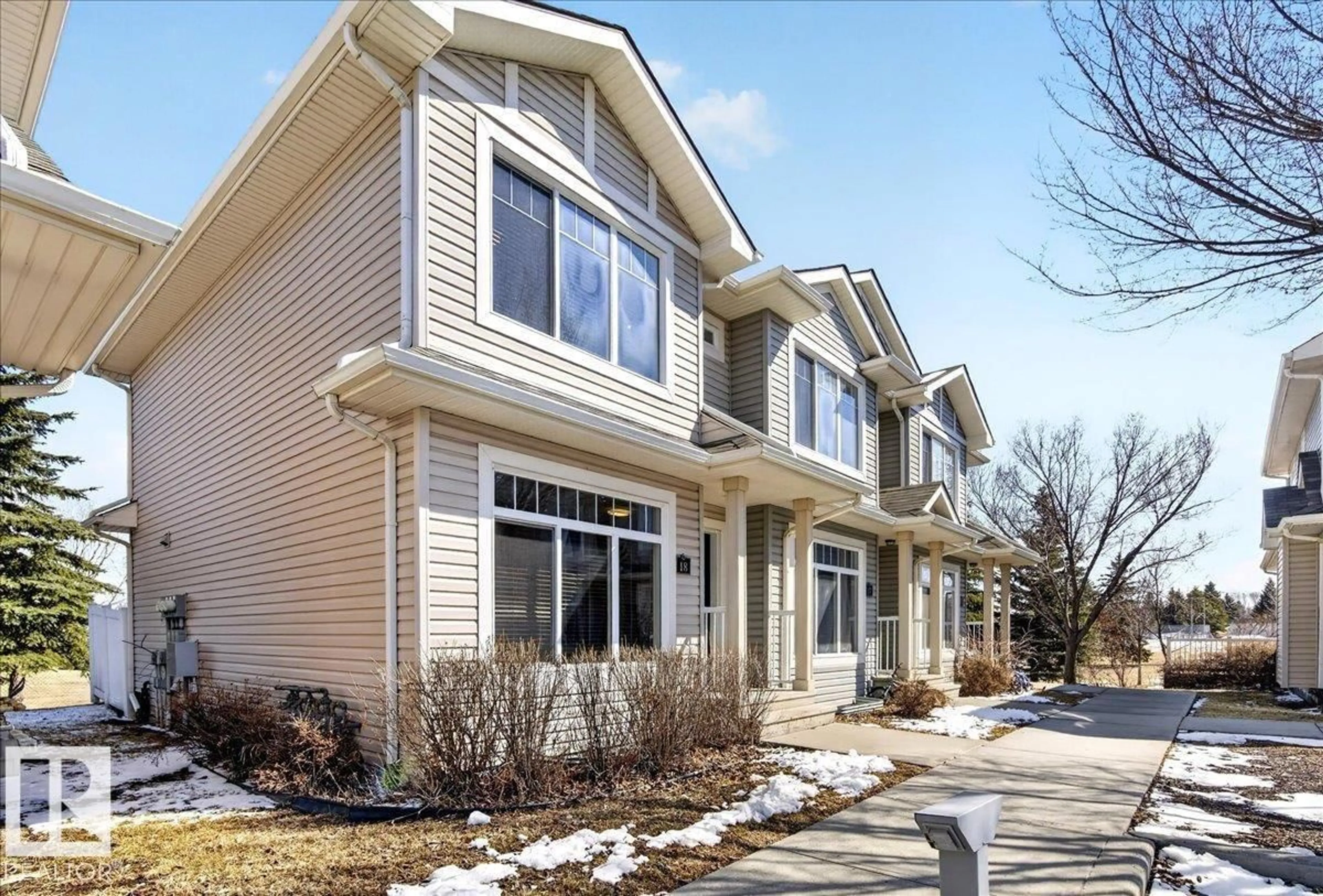 Home with vinyl exterior material, street for #18 - 6032 38 AV NW, Edmonton Alberta T6L0A4
